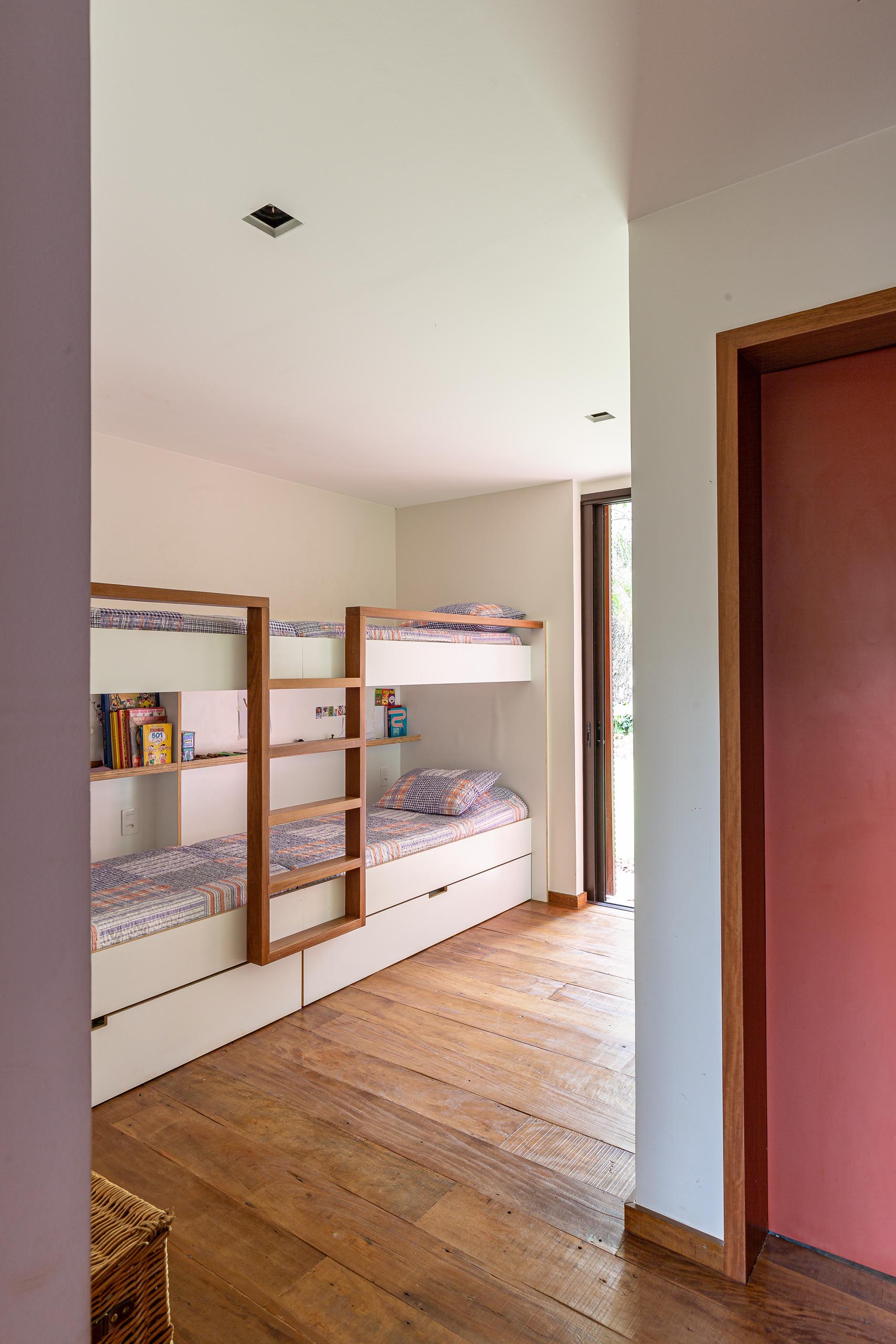 In this modern bedroom there's custom-built bunk beds, allowing for multiple people to sleep in the one room.