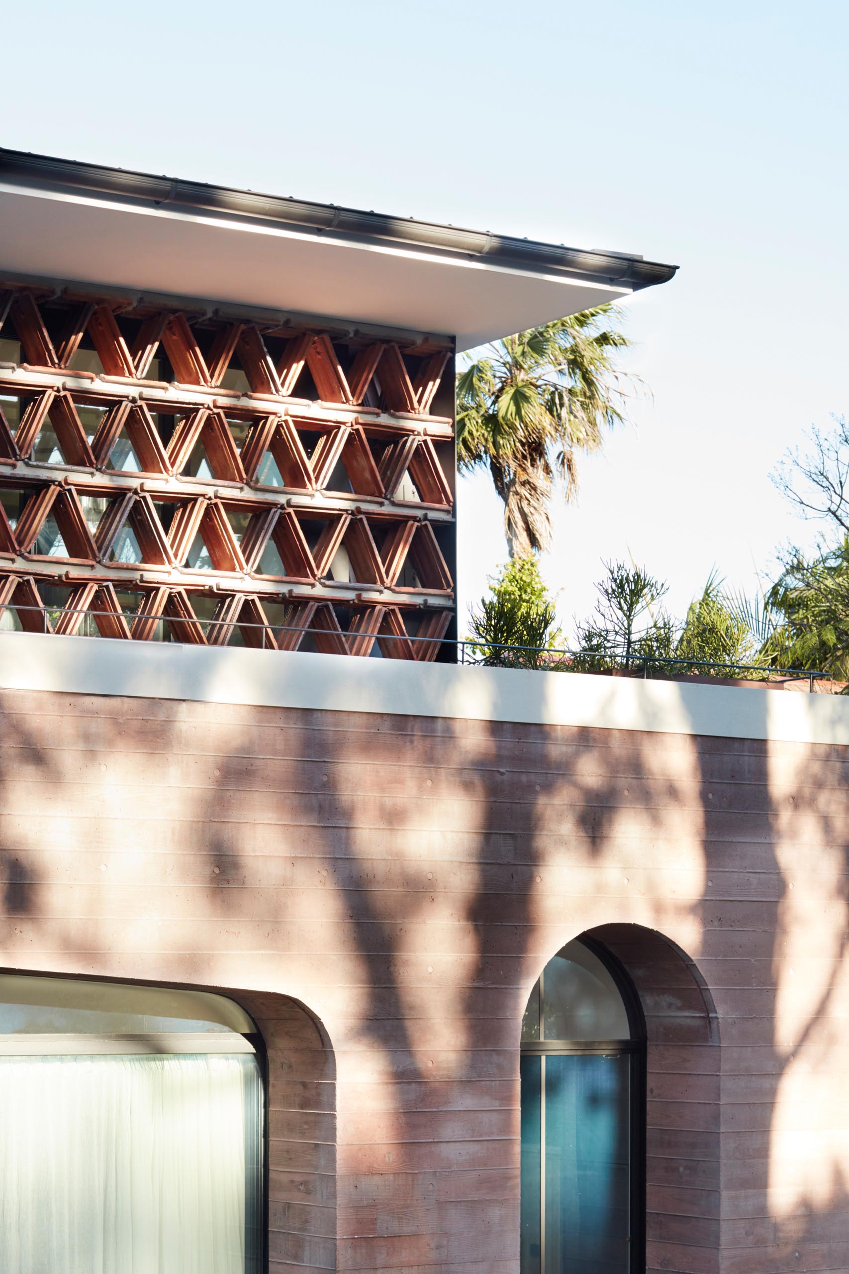 A modern home extension made from pink concrete.