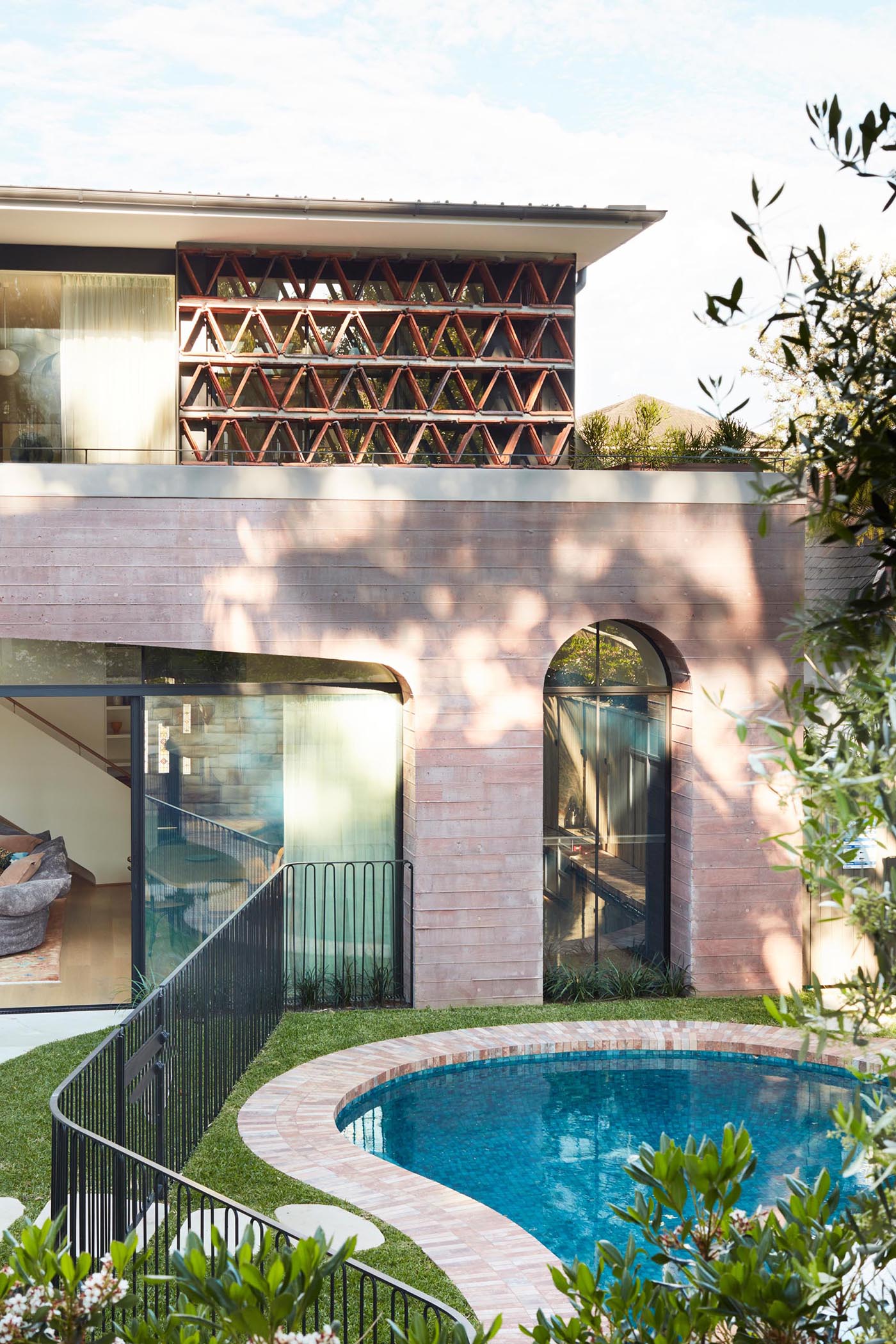 A modern home extension made from pink concrete.