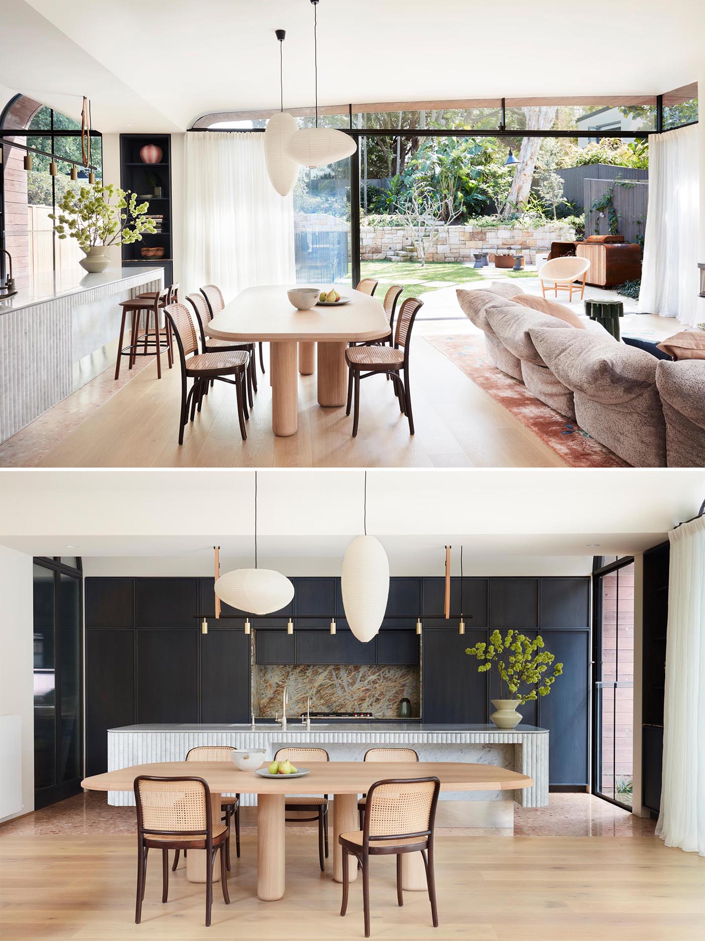 This dining area is used to separate the living room and kitchen, and is anchored by two pendant lights.