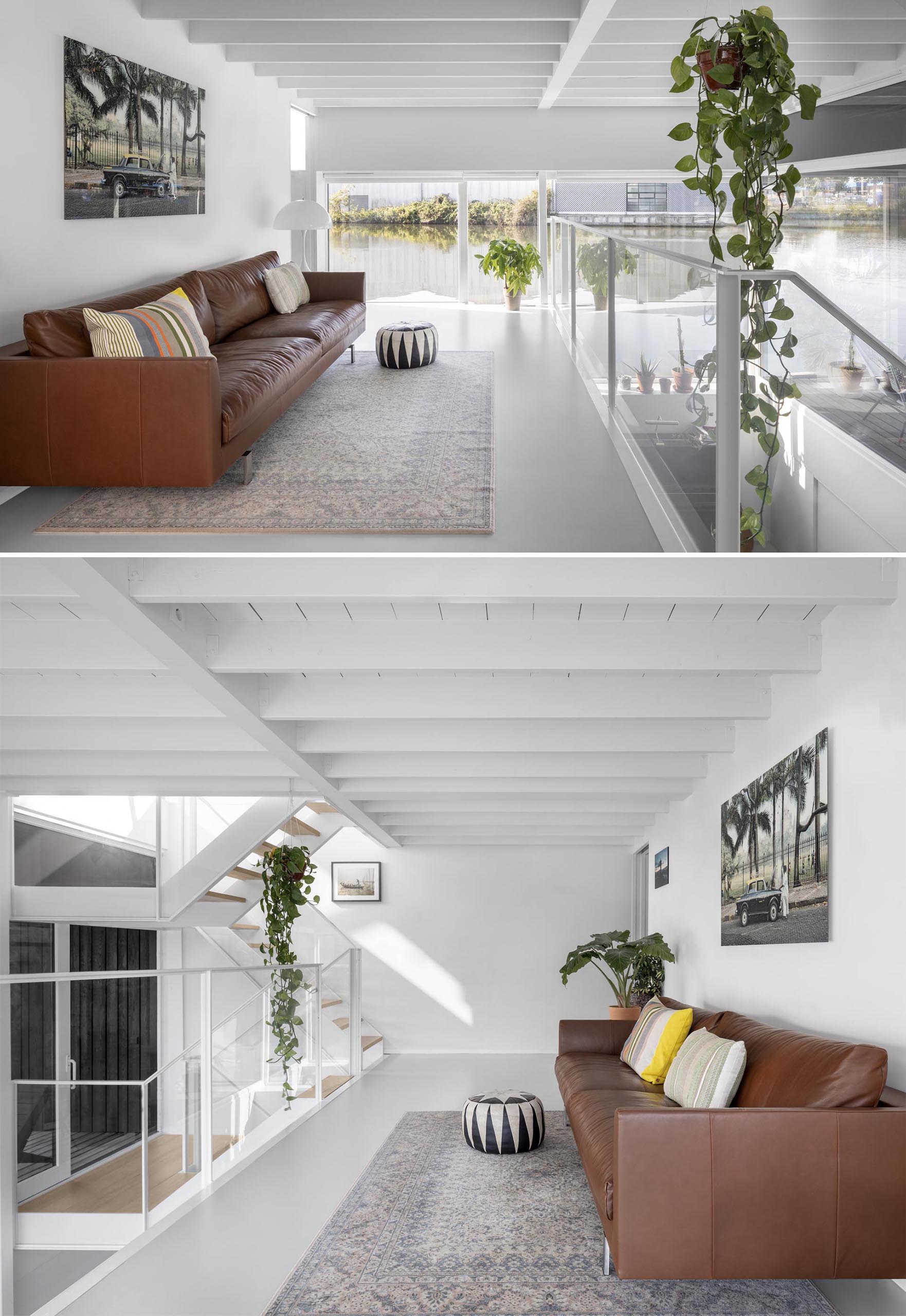 A modern float home with white walls, and a minimally furnished living room.