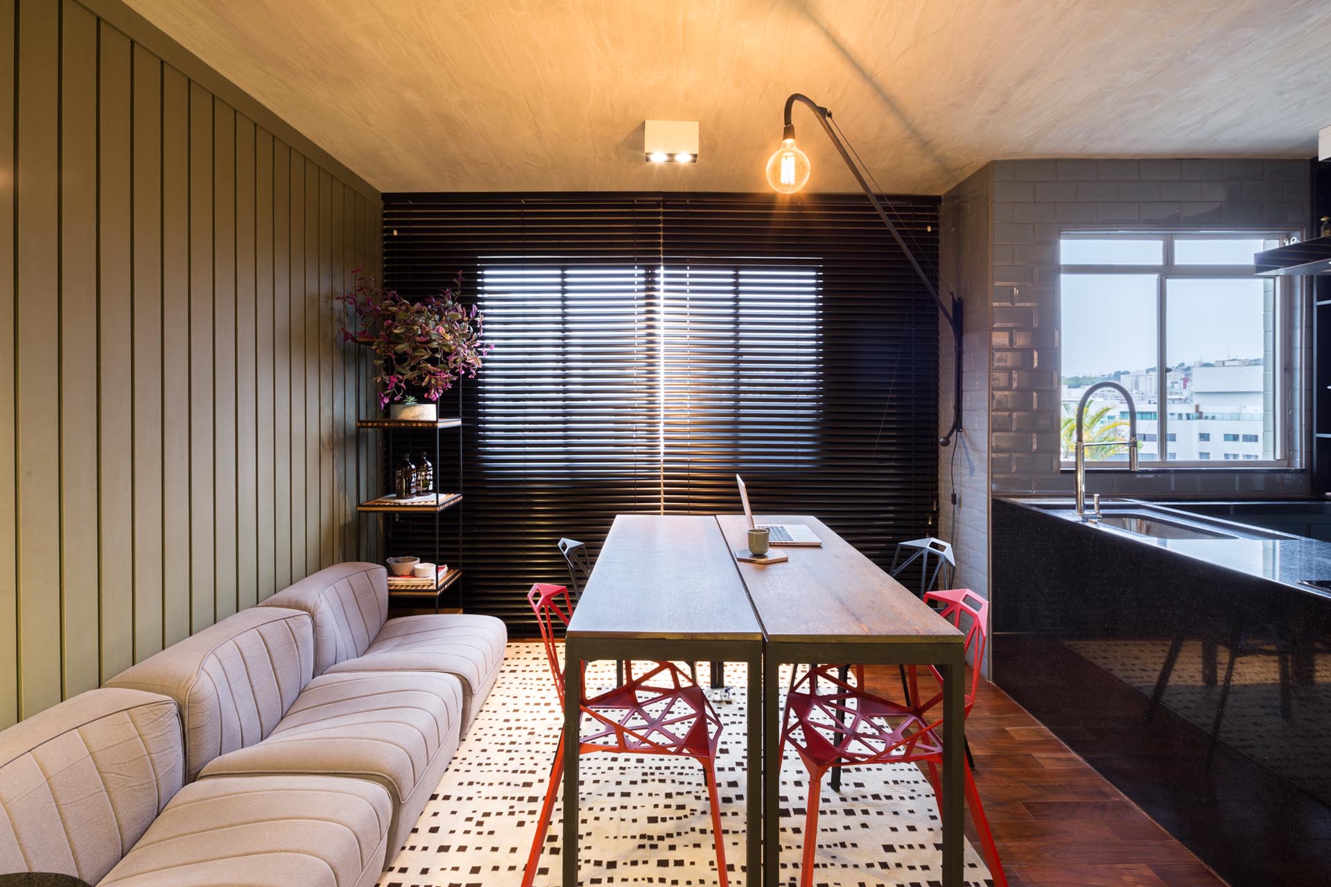 A modern living room with moveable tables that act as a dining tables. 