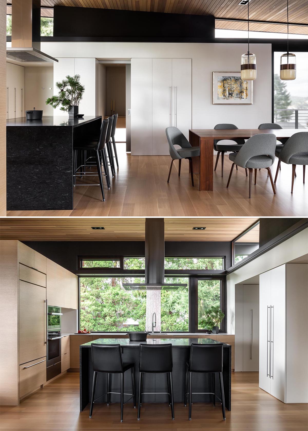 A modern kitchen with wood and white cabinets, and a black island.