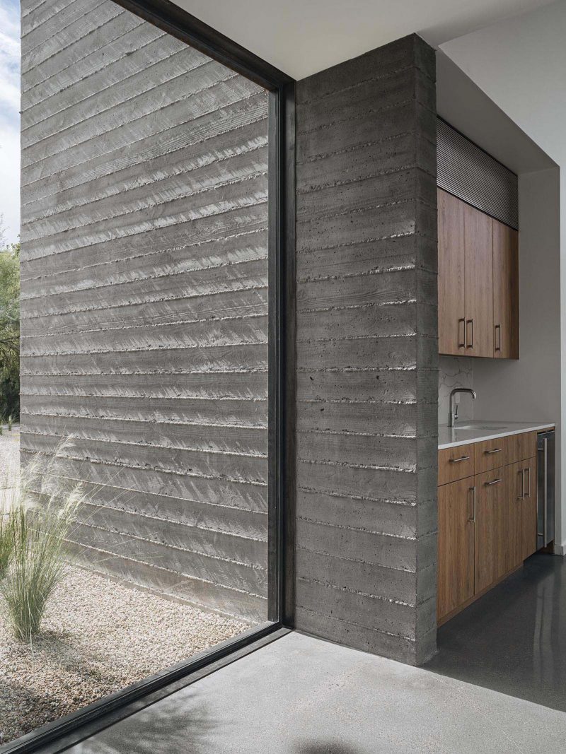 A modern home with board formed concrete walls.