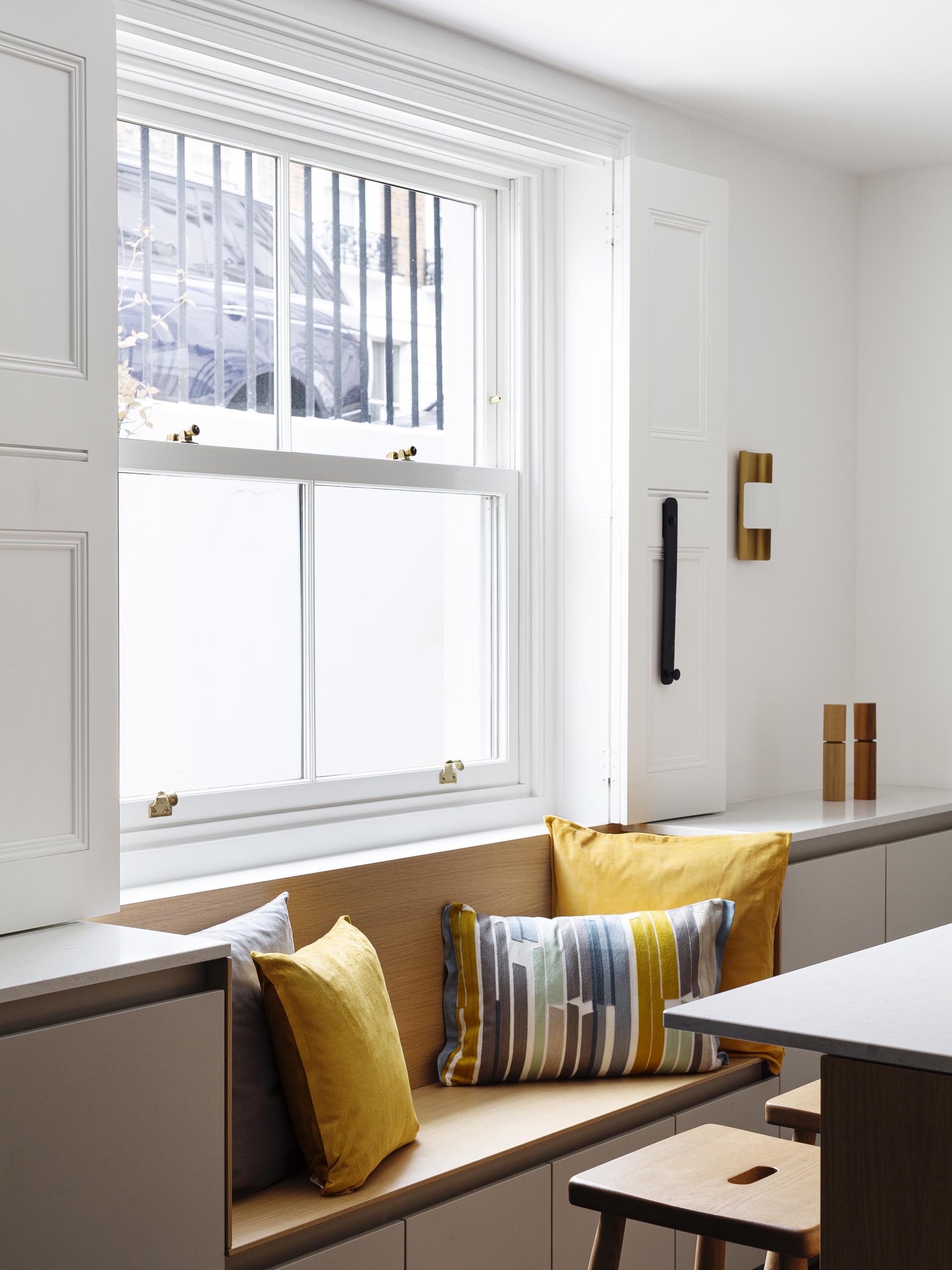 A built-in bench with storage below the window.