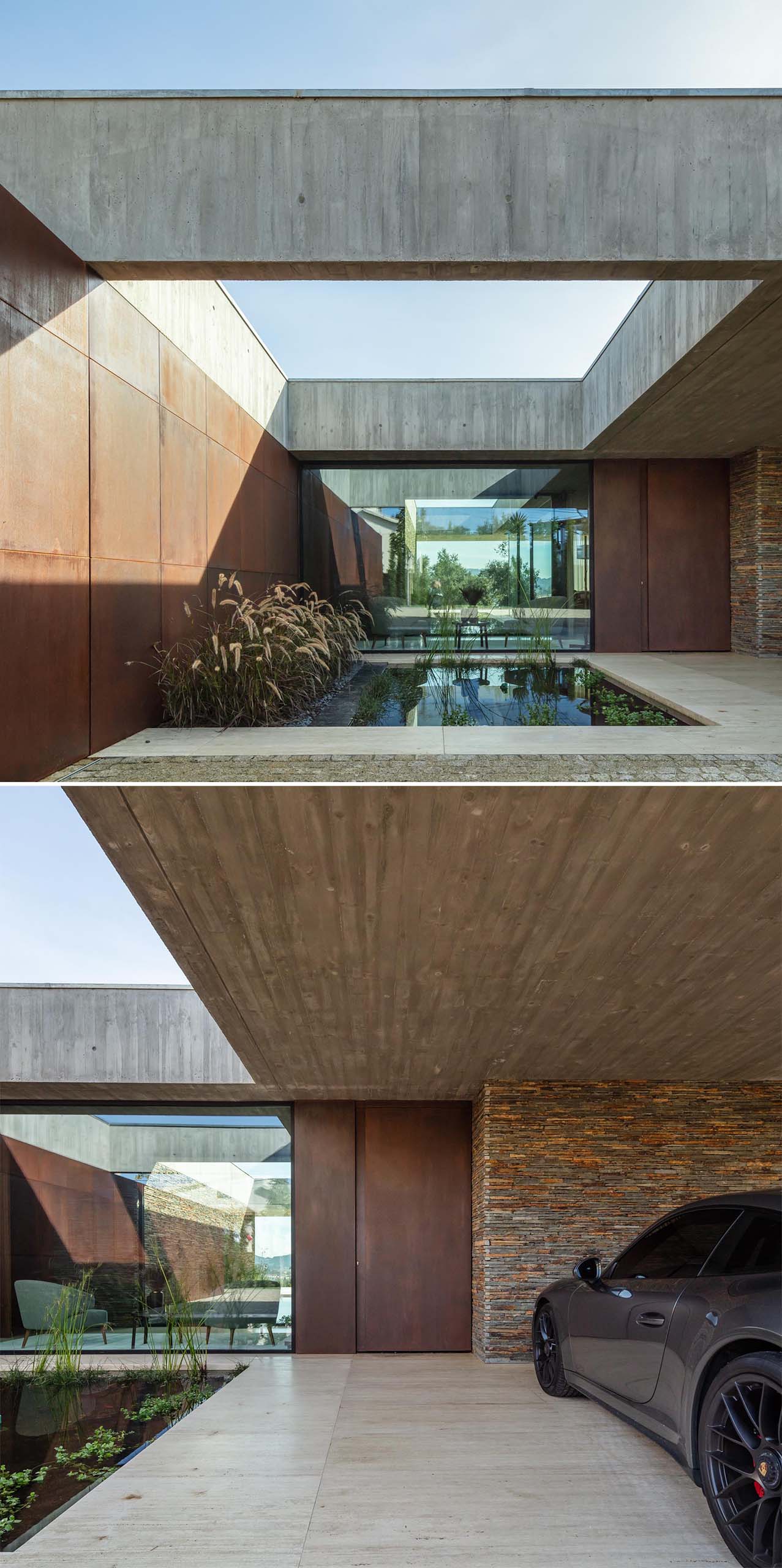 A modern concrete house with weathered steel and slate stone accent walls, and a water feature with plants.