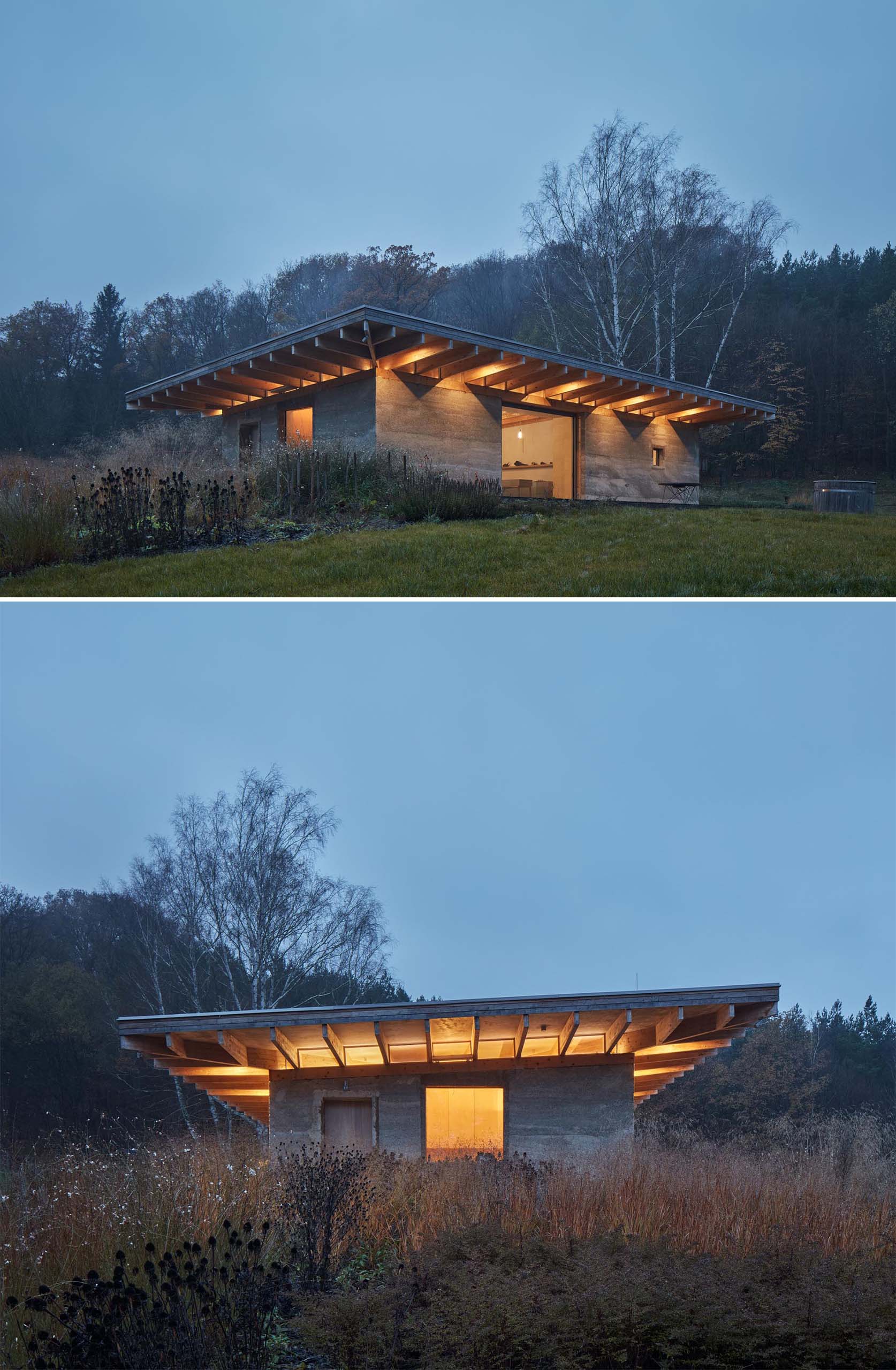 A modern cabin with a green roof and hempcrete walls is surrounded by nature.