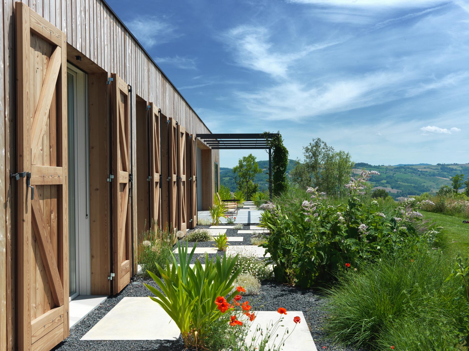 Shutters have been installed on the home to protected it from the external elements, while the window fixtures are made of varnished fir laminate with high performance structured glass.