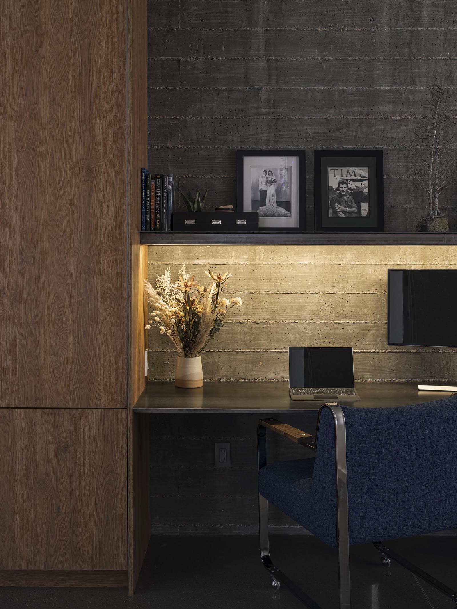 A dedicated homework station is tucked into the hallway of this modern home, and has room for multiple people.