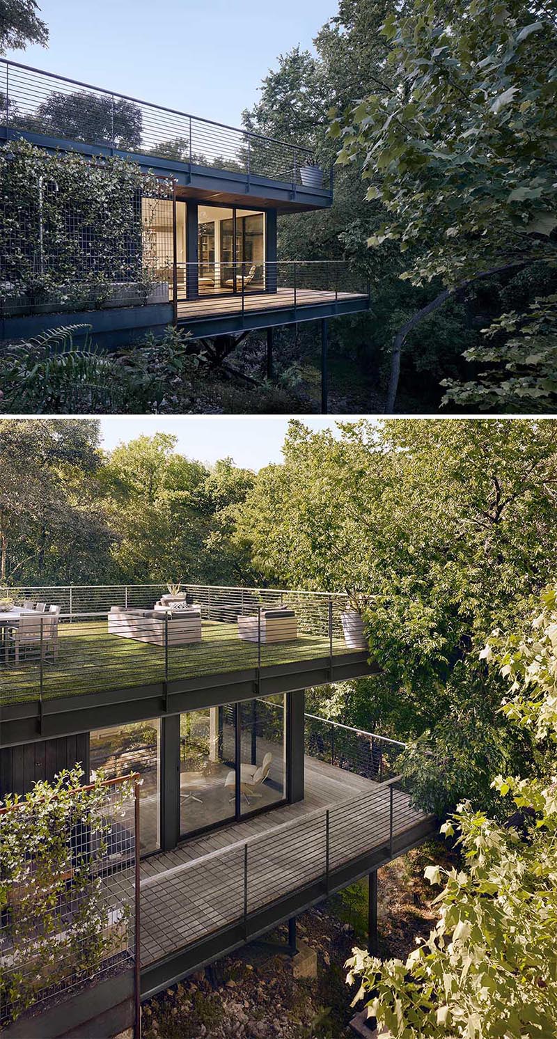 A modern home addition with a green roof and a wrap-around deck.