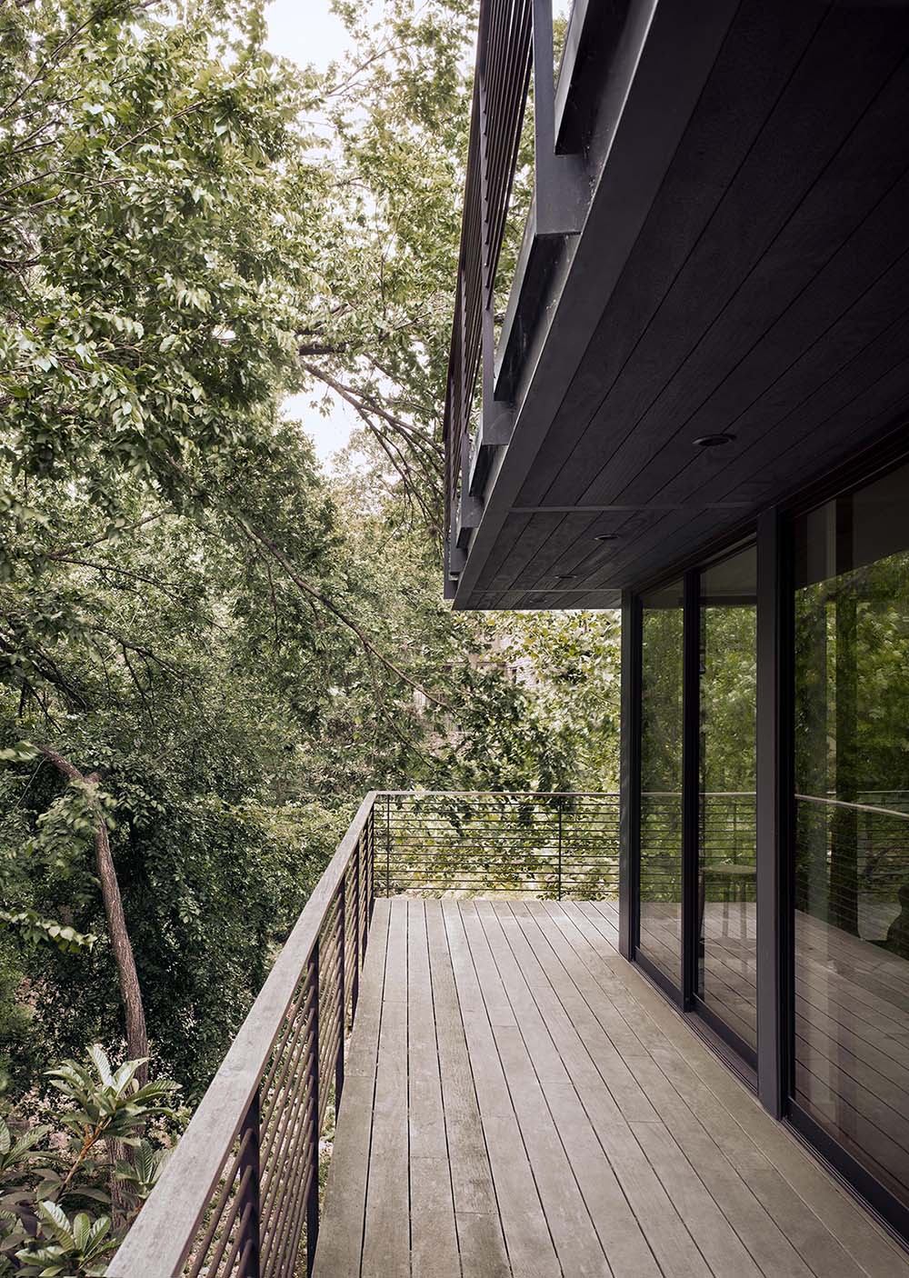 A wrap-around deck provides views of the trees, with a staircase the allows for easy access around the property.