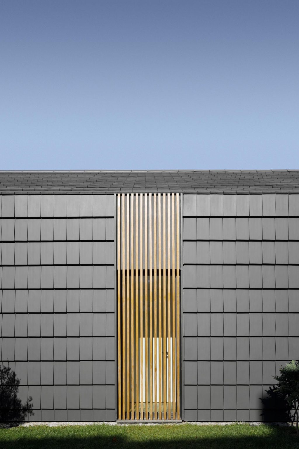 Wood Slats On The Exterior Of This House Hide Some Windows And Doors