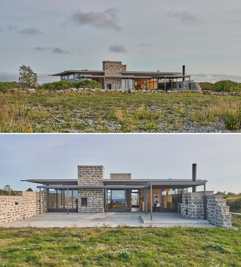 A modern home with glass and limestone walls.