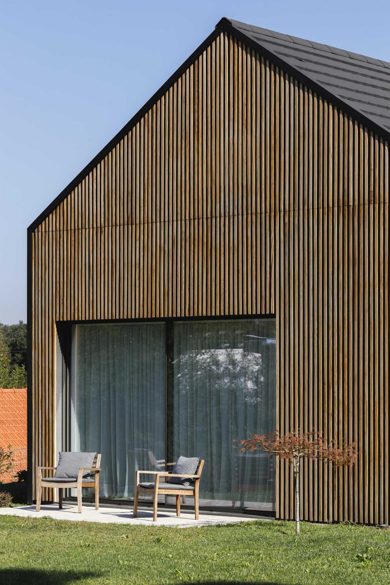 Wood Slats On The Exterior Of This House Hide Some Windows And Doors
