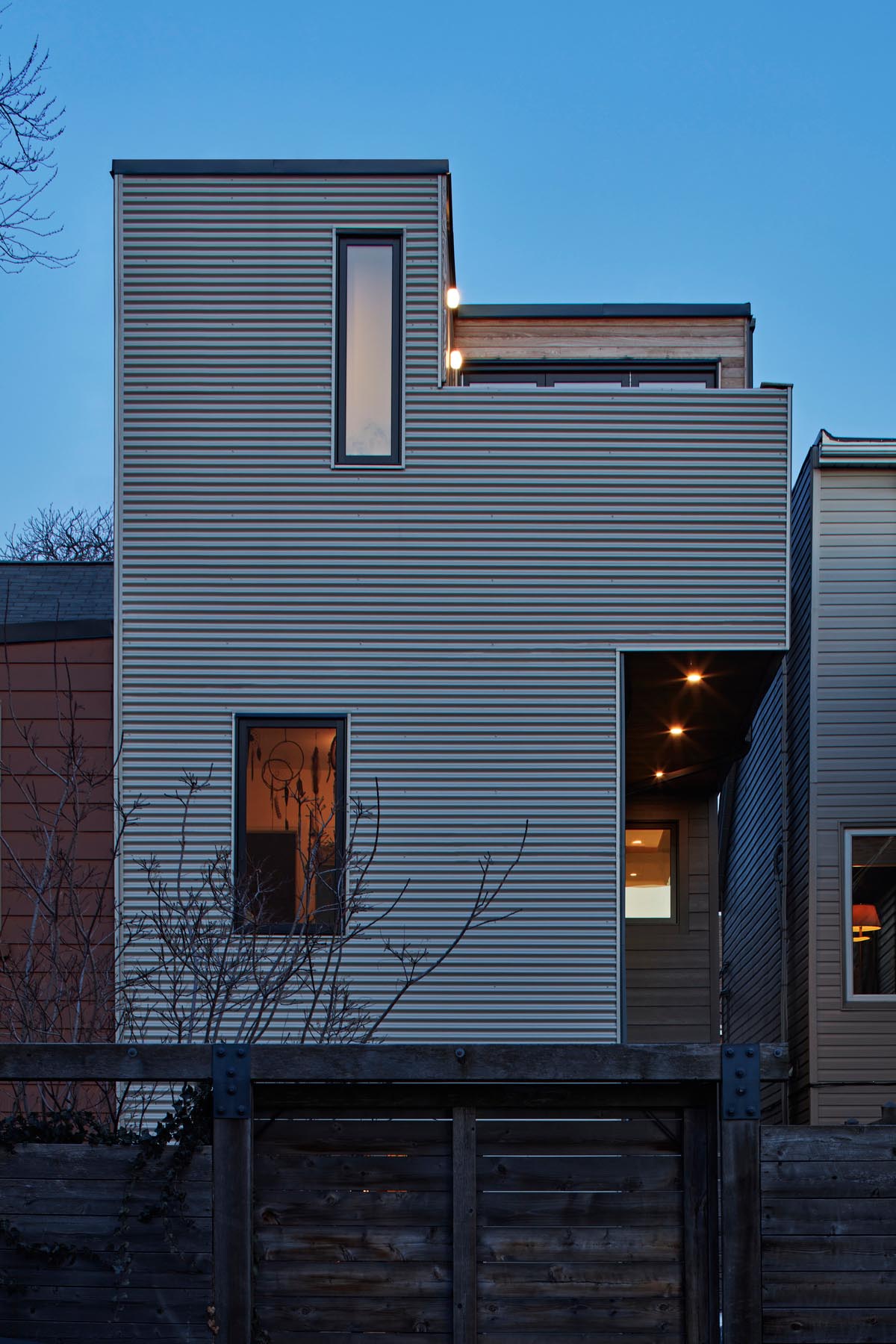 A modern house extension that added a third floor to a Victorian home.