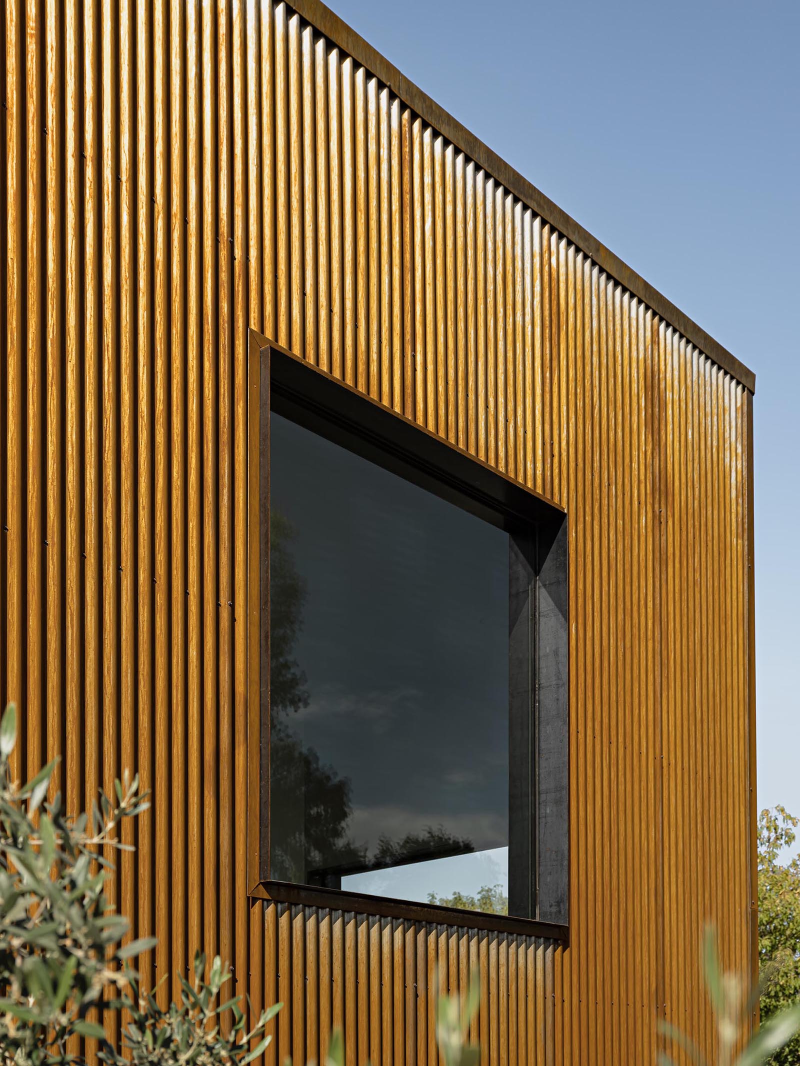 Weathered corrugated metal siding.