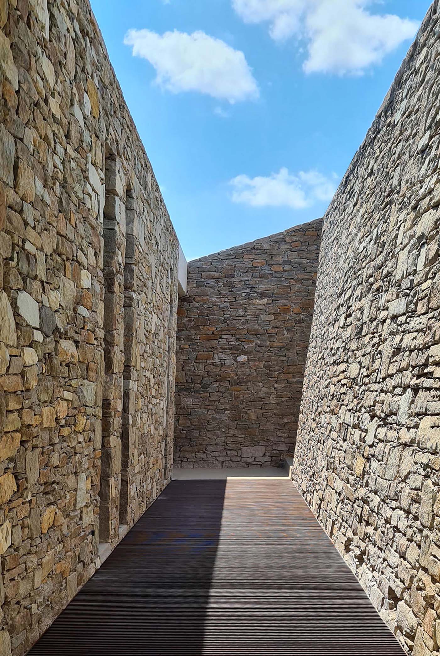 A modern home with an abundance of stone walls.