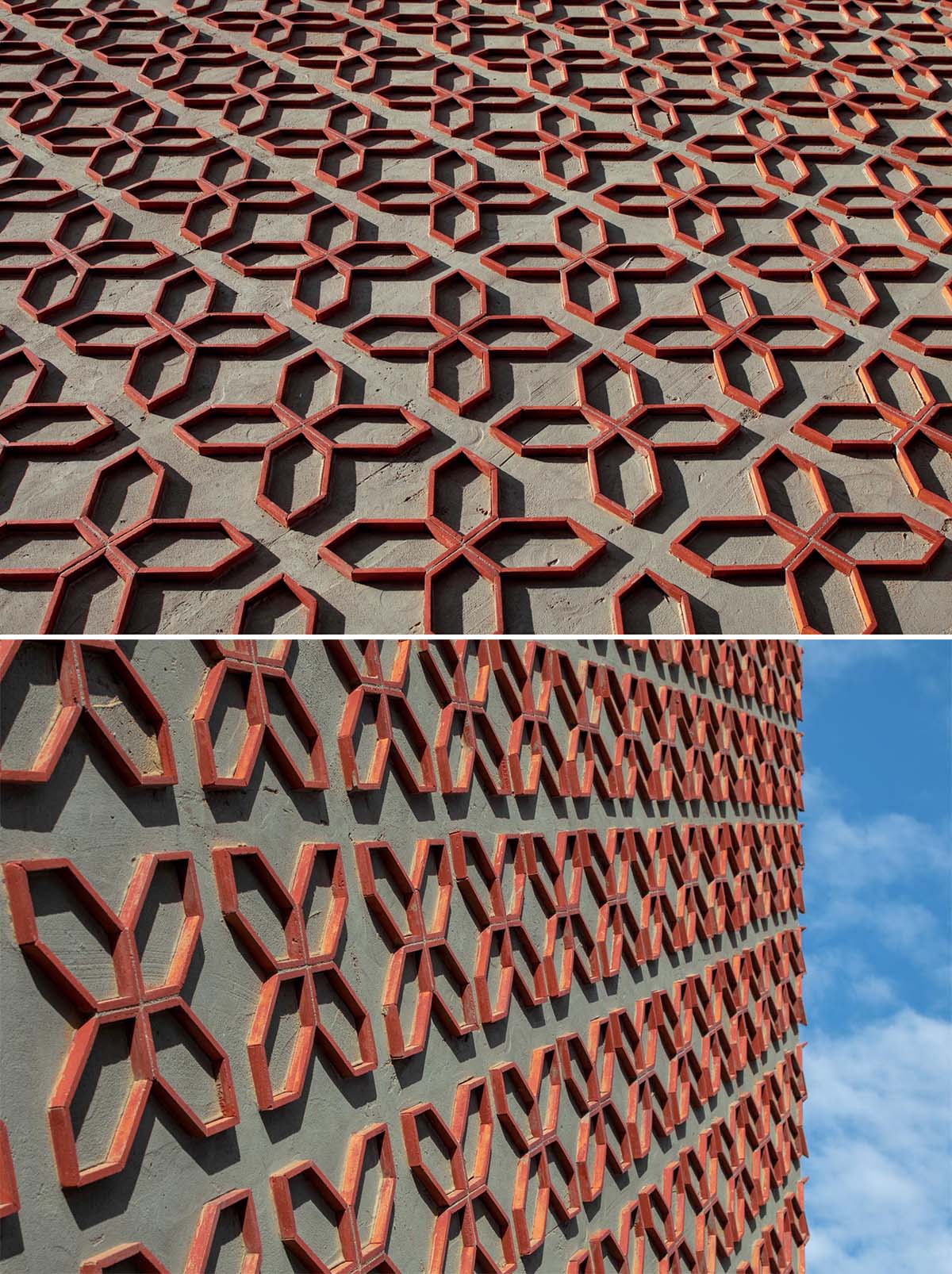 A patterned wall made from cut clay roof tiles.