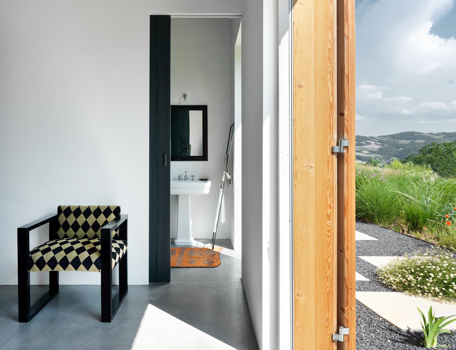 An ensuite bathroom with a black sliding door.