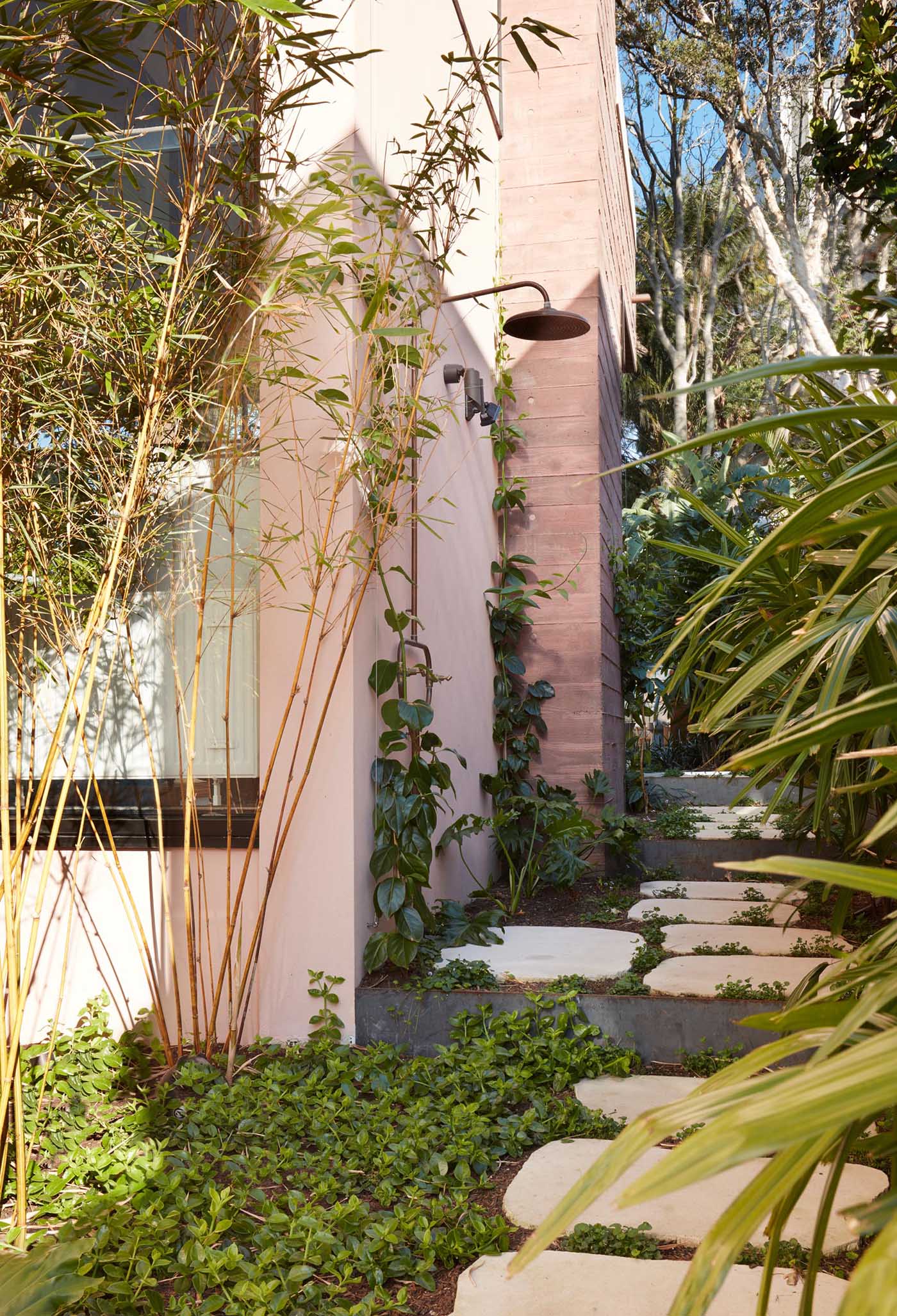 This home has an outdoor shower that's tucked away at the side of the home.