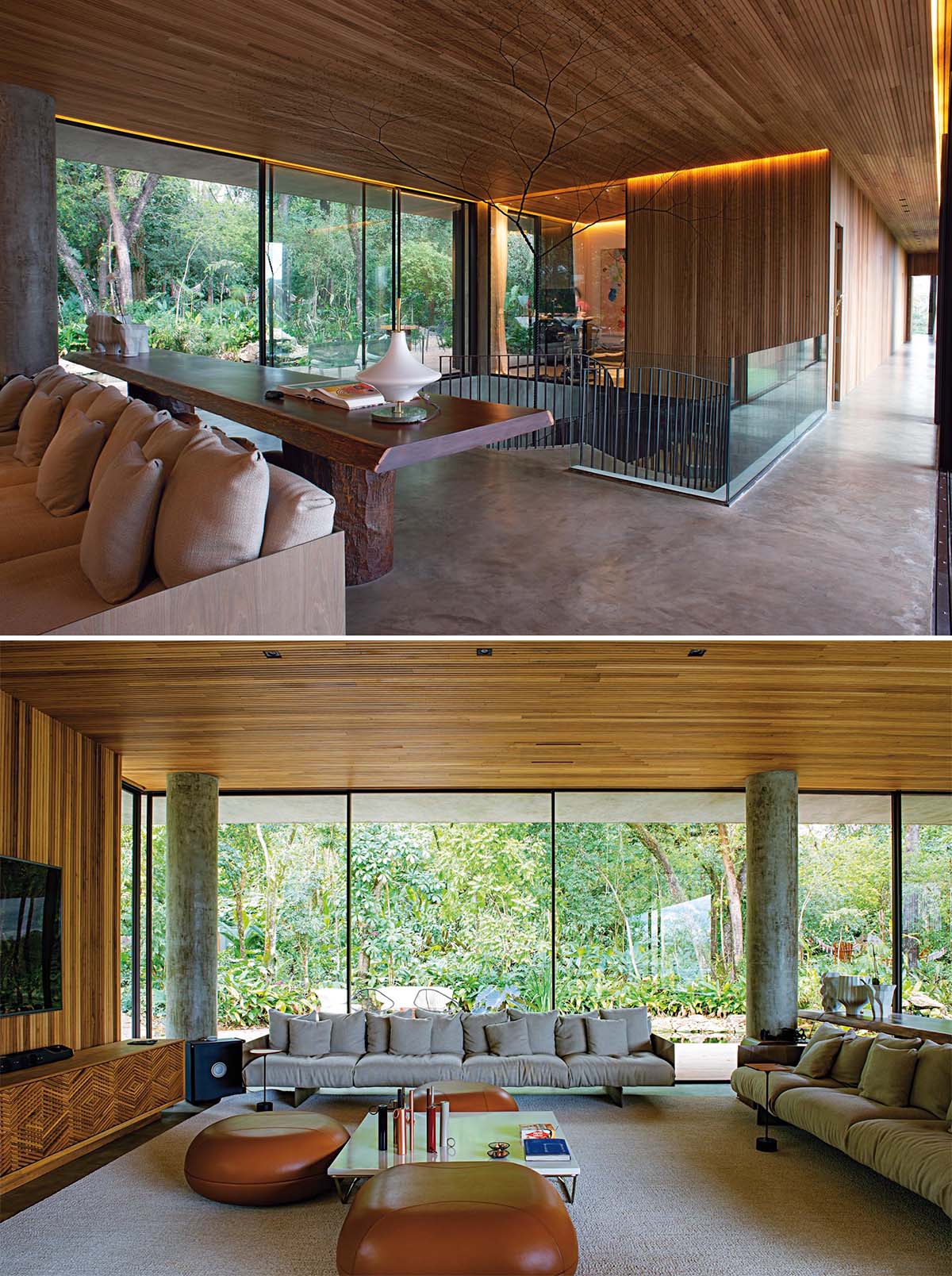 A wood ceiling and golden lighting adds a sense of warmth to this moderninterior, that also includes concrete floors, a hanging fireplace, and glass walls.