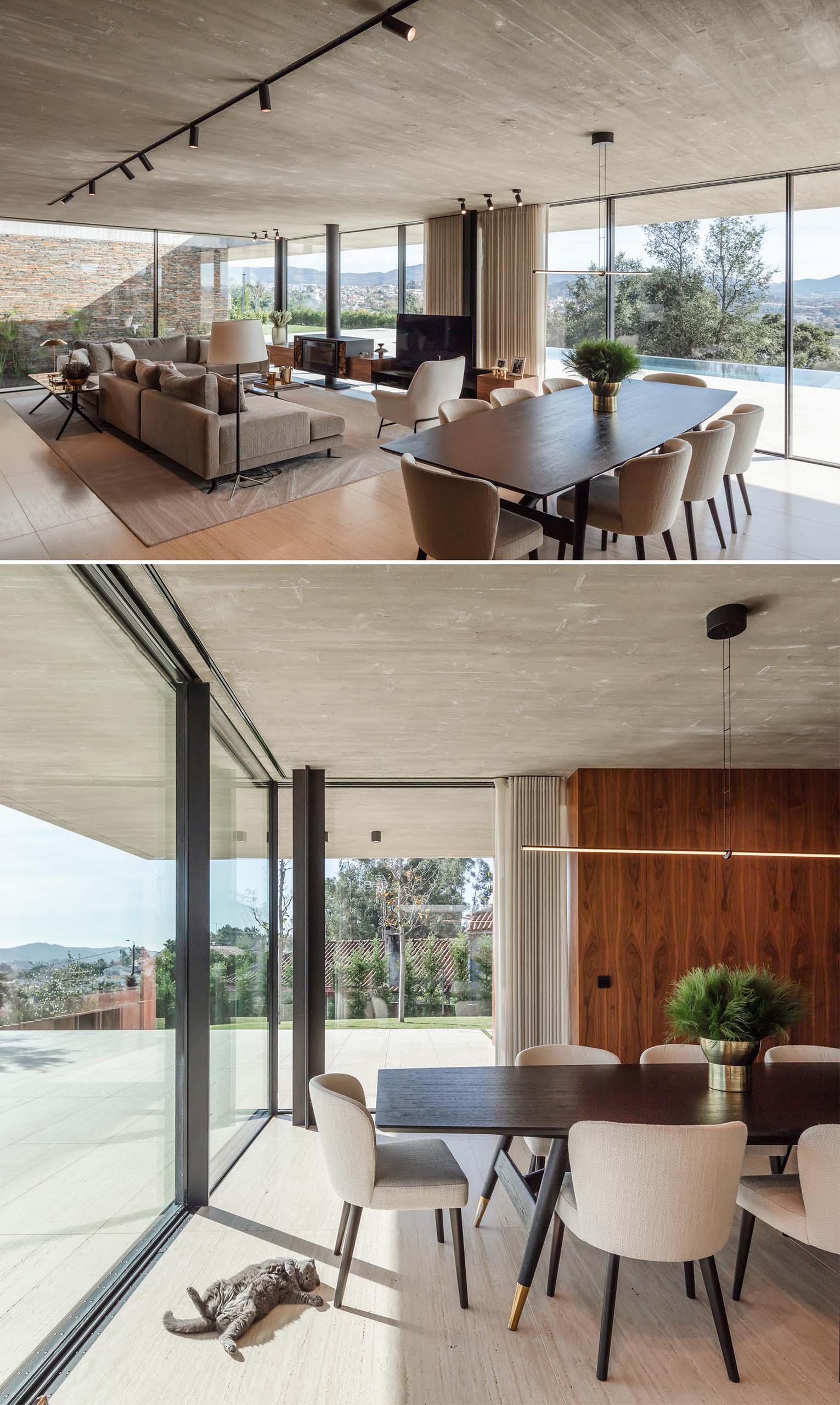 A modern open plan dining area with a wood table, upholstered chairs, and a minimalist linear suspension lamp.