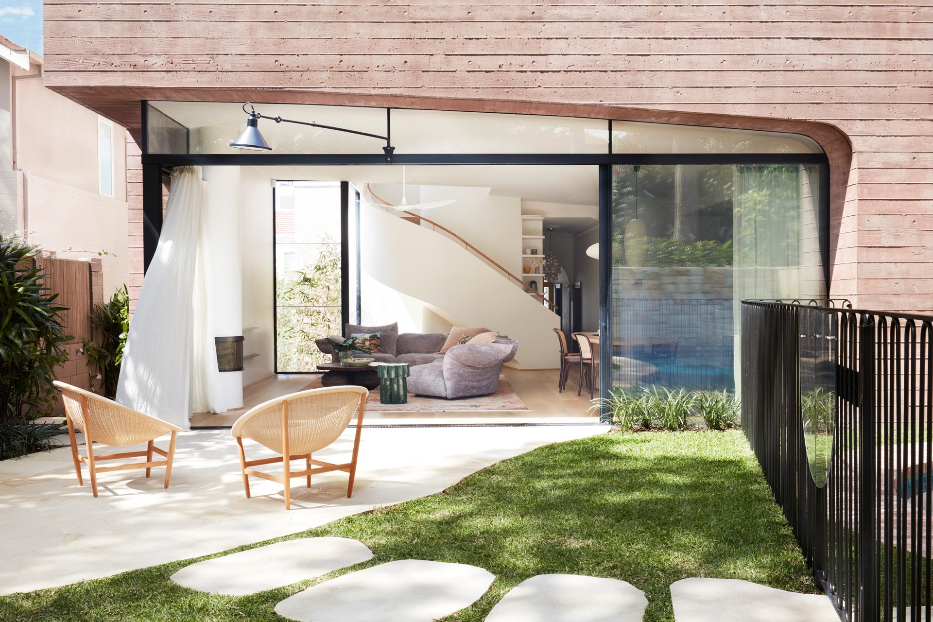 This simple patio is connected to the interior spaces by a large sliding glass door.