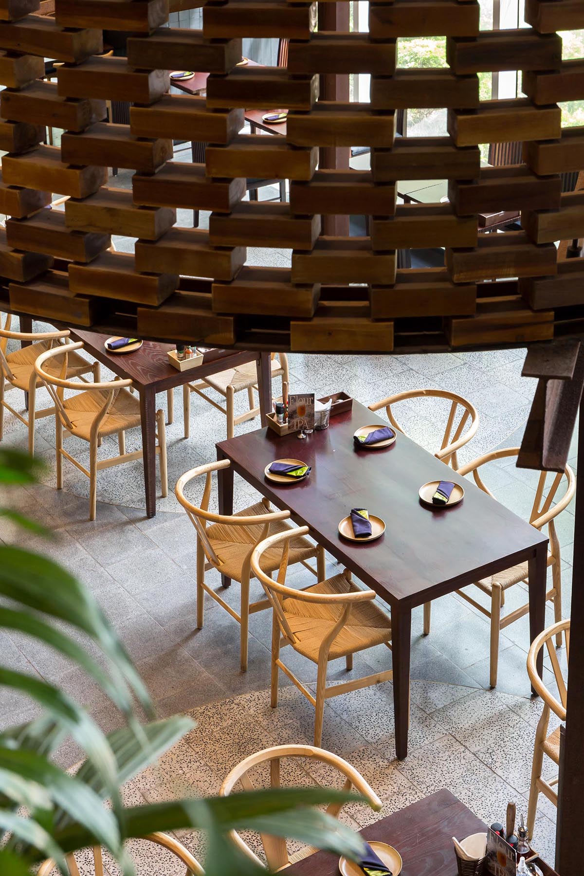 A contemporary restaurant with wood furniture.