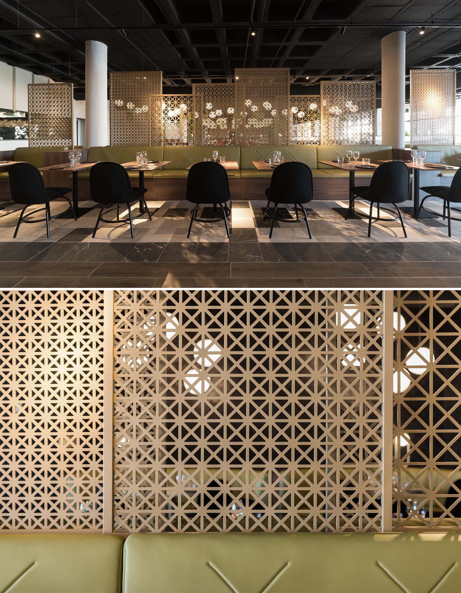 A modern restaurant with greenery, multiple seating areas, patterned wood screens, and plenty of lighting.