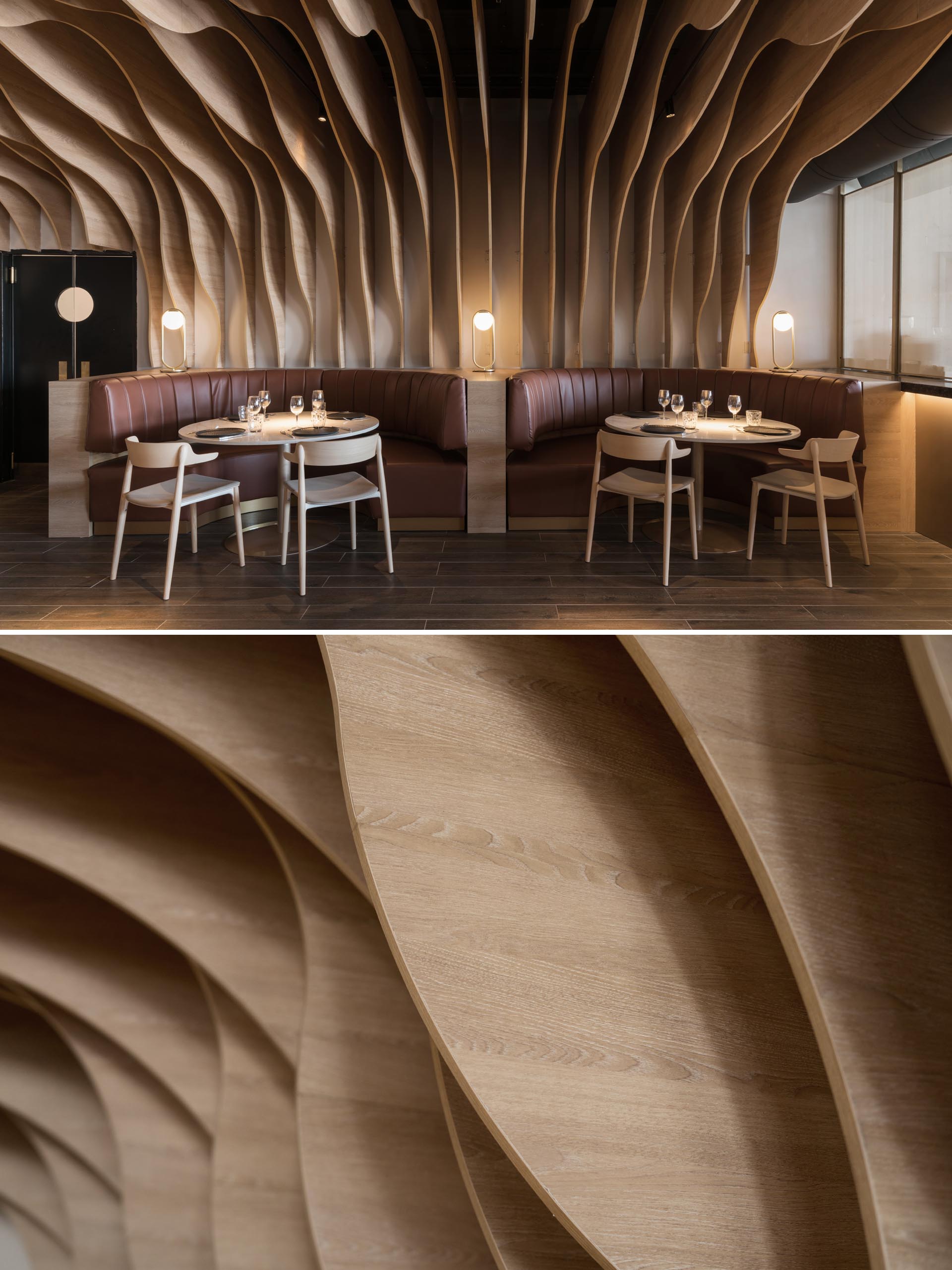 A modern restaurant with sculptural wood fins that cover the walls and ceiling, and match the surrounding furniture and banquettes.