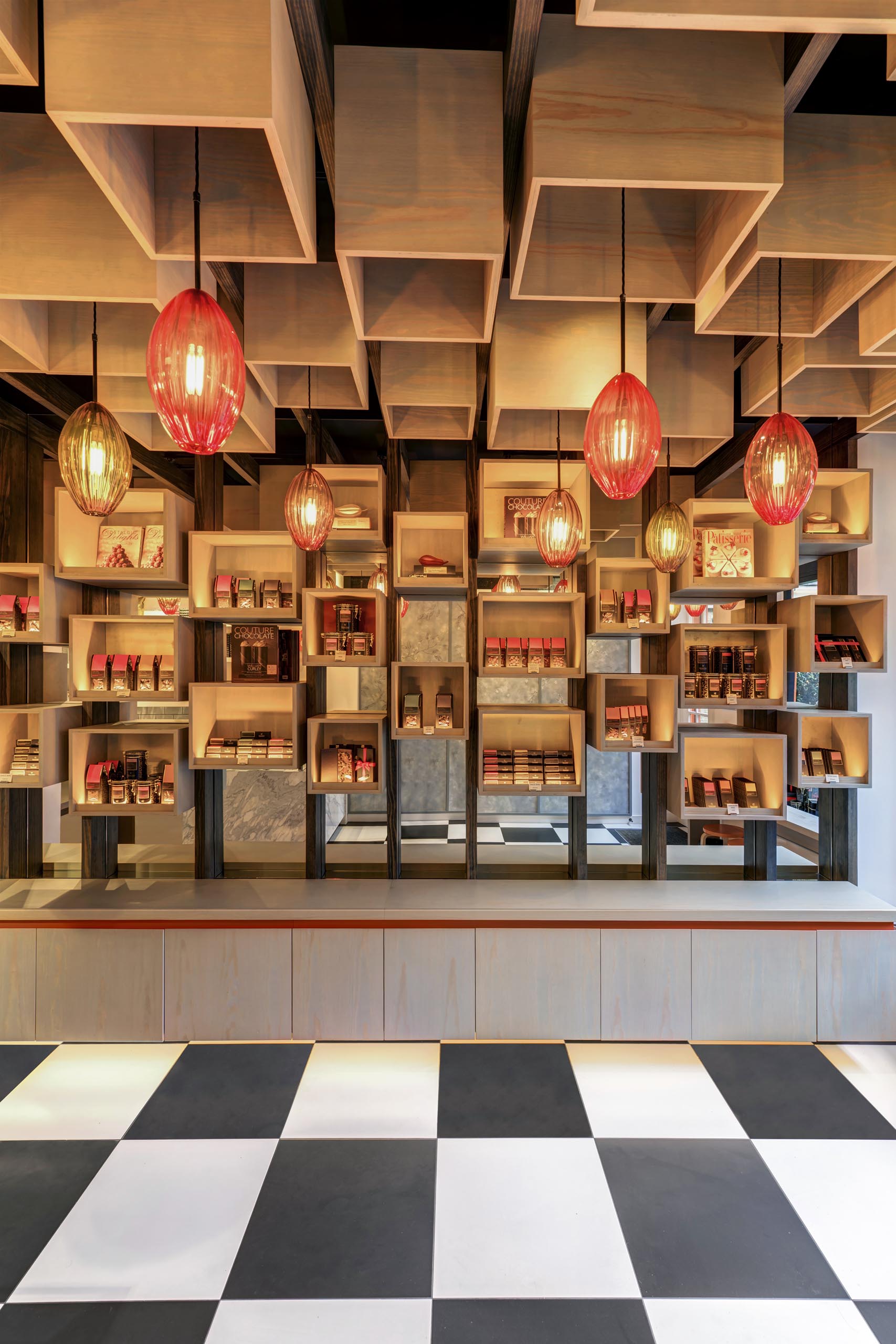 A modern retail store with wood boxes on the wall and ceiling.