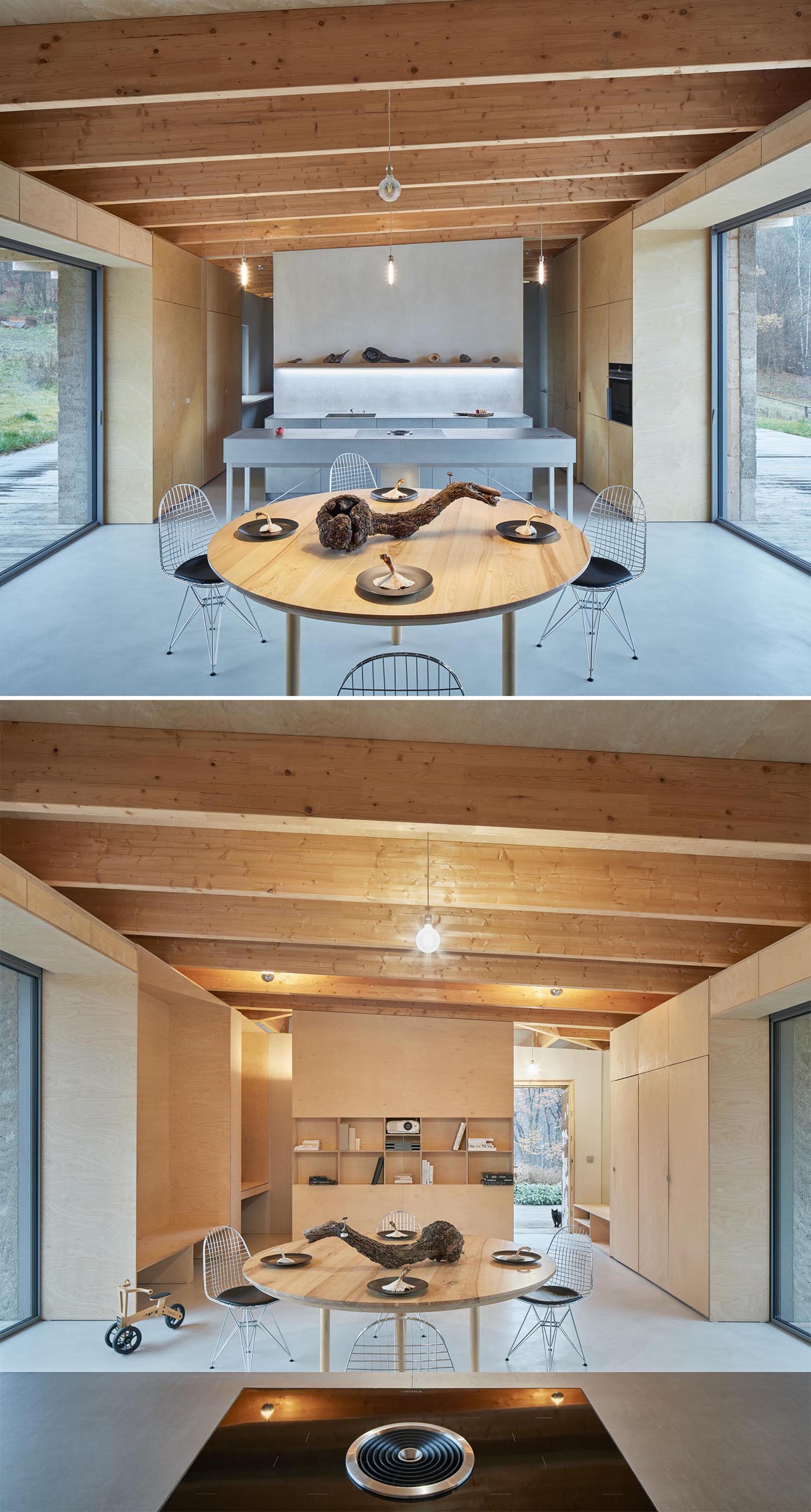 Large glass doors on either side of the social areas of this modern cabin, fill the interior with natural light and open to the deck that surrounds the home.