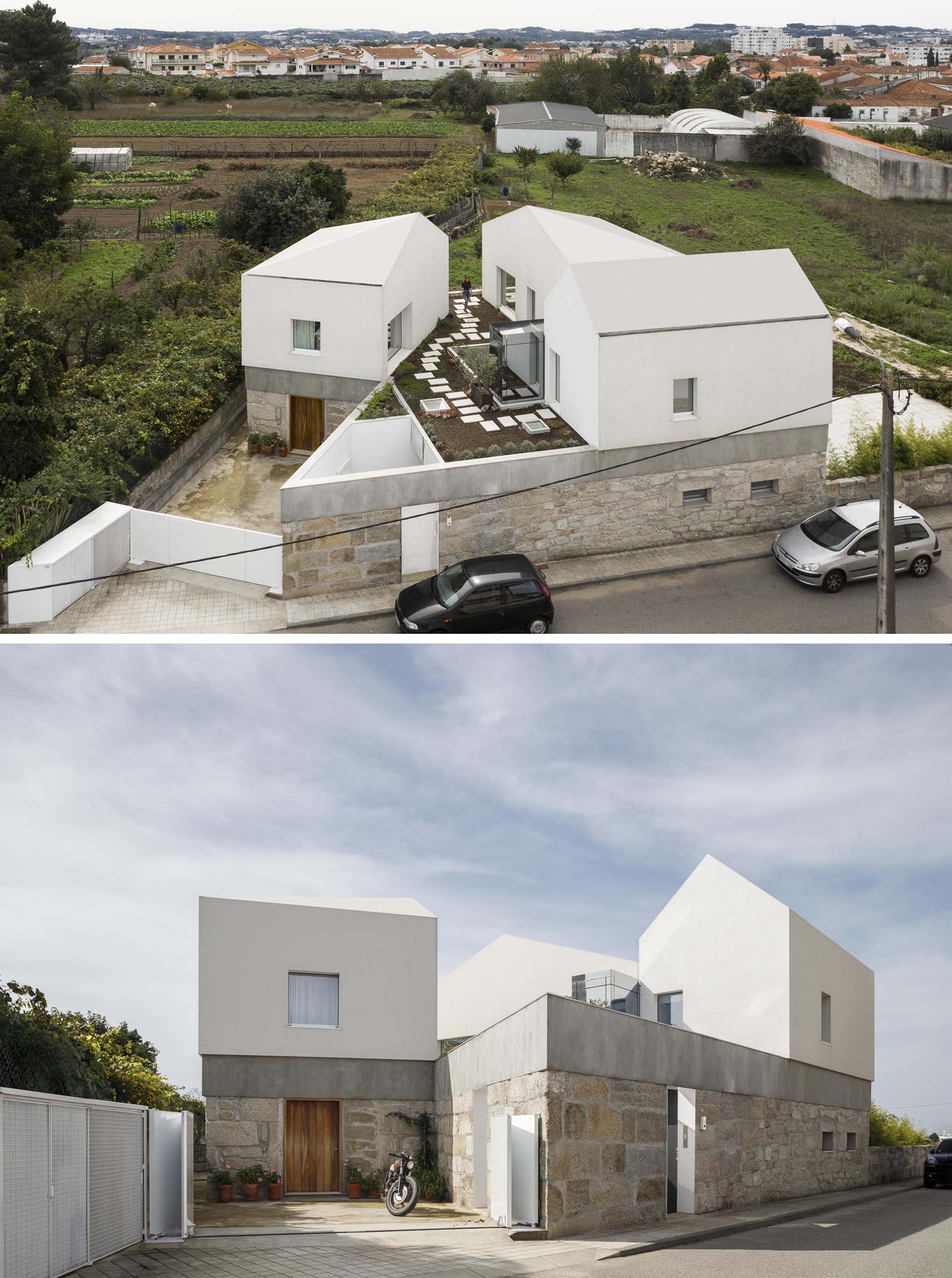 A modern home with stone walls, concrete and wood accents, and a rooftop garden.