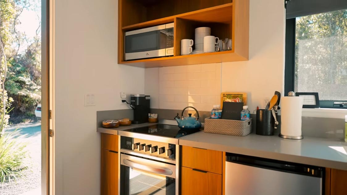 A small kitchenette within a modern tiny home.