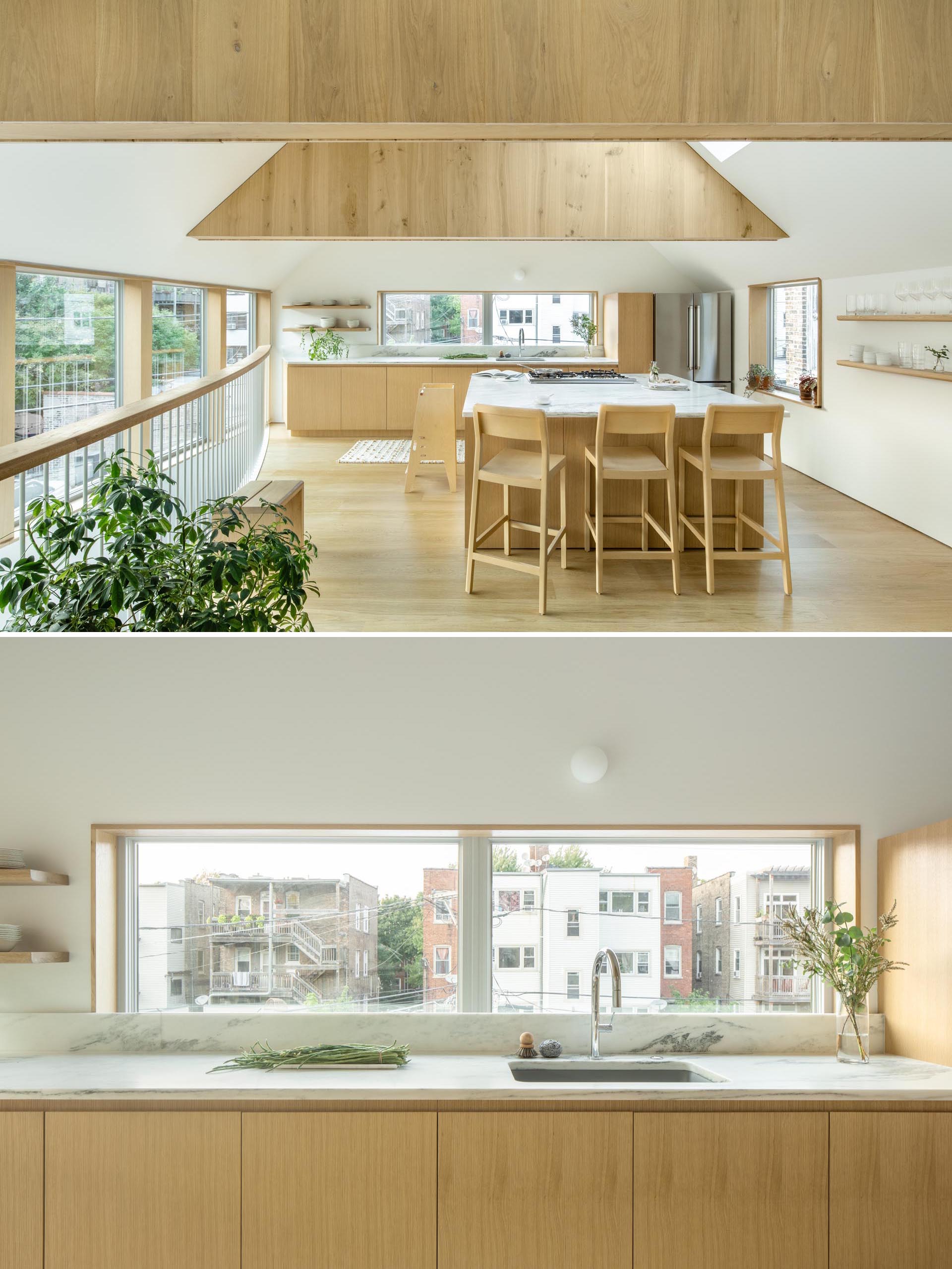 This modern kitchen has floating wood shelves, white countertops, and an island with seating. 