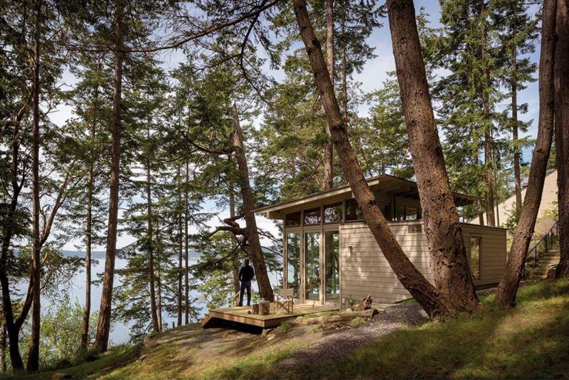 A small wood cabin that's used as a painting studio or guest house.