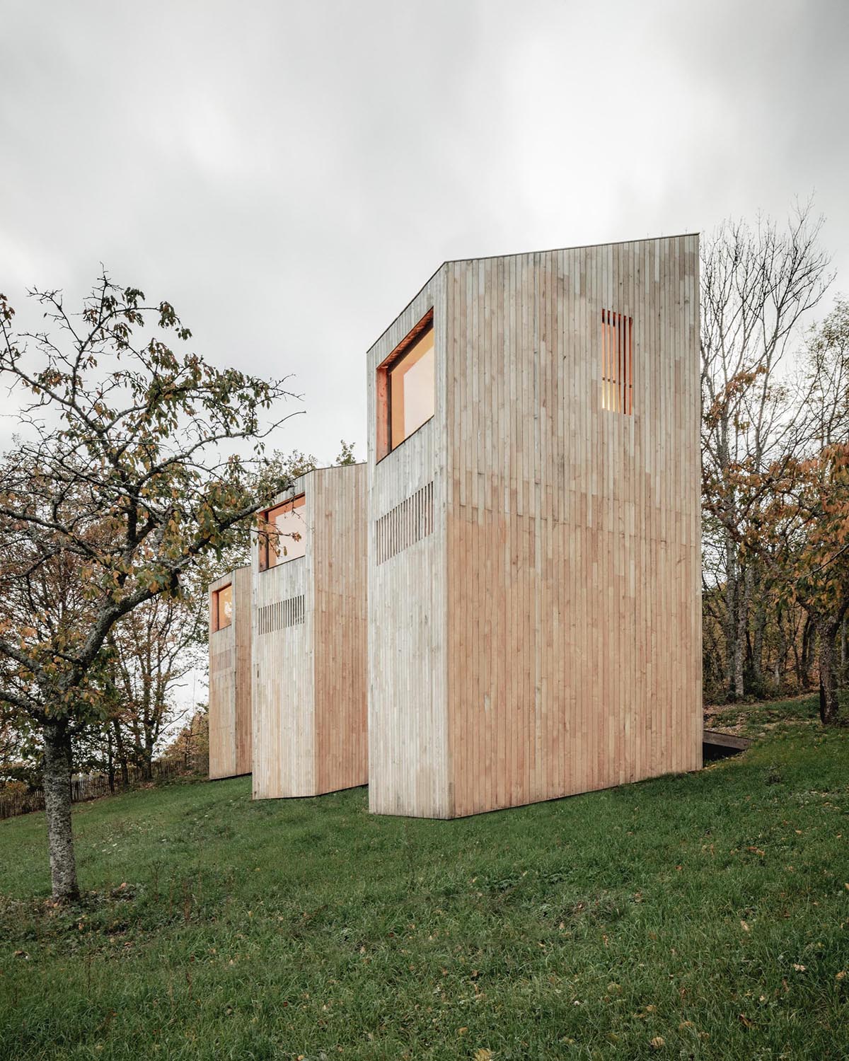 Light wood cabins designed as part of a hotel in France.