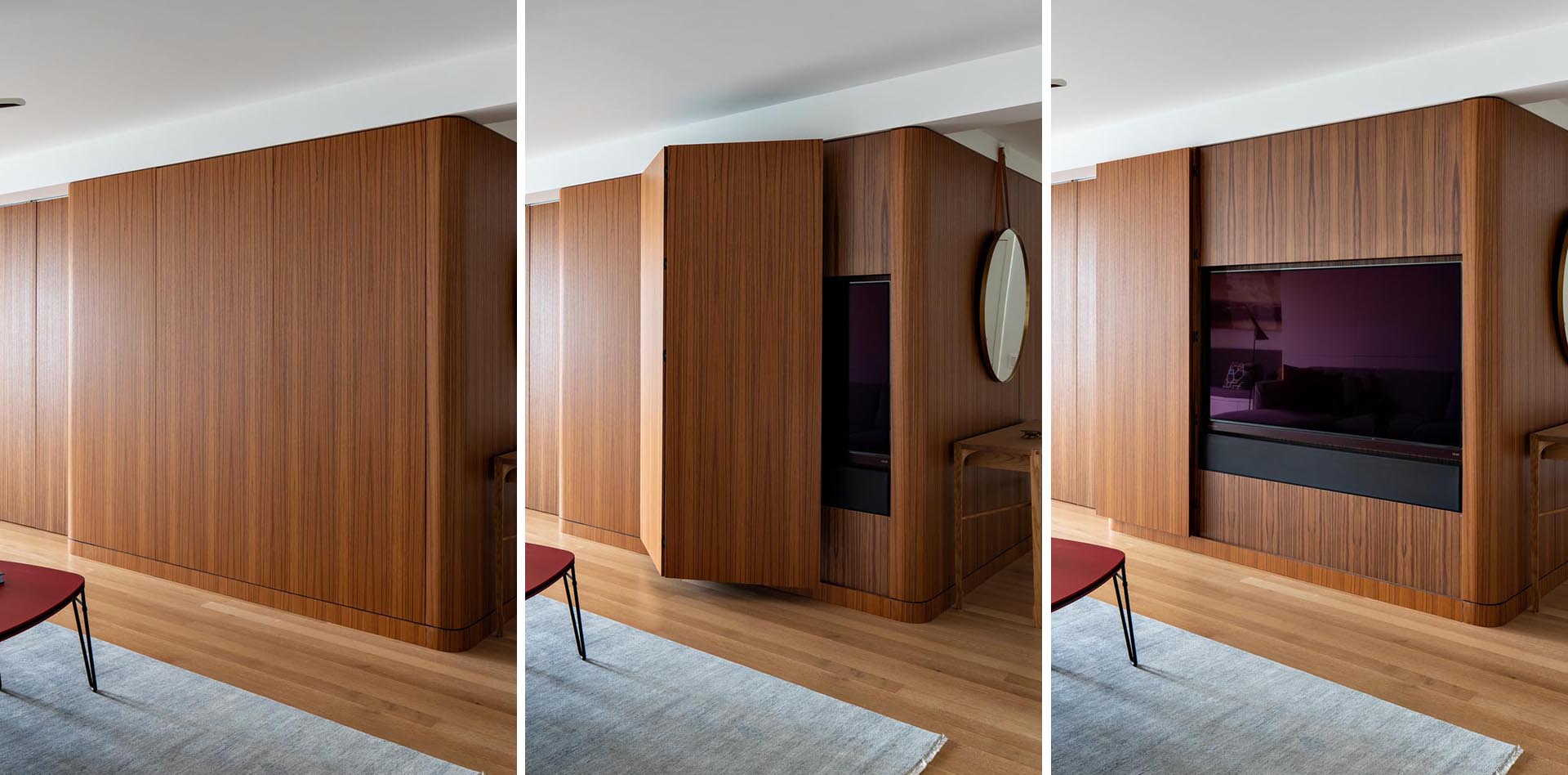 A modern apartment with a wood wall that hides the tv.