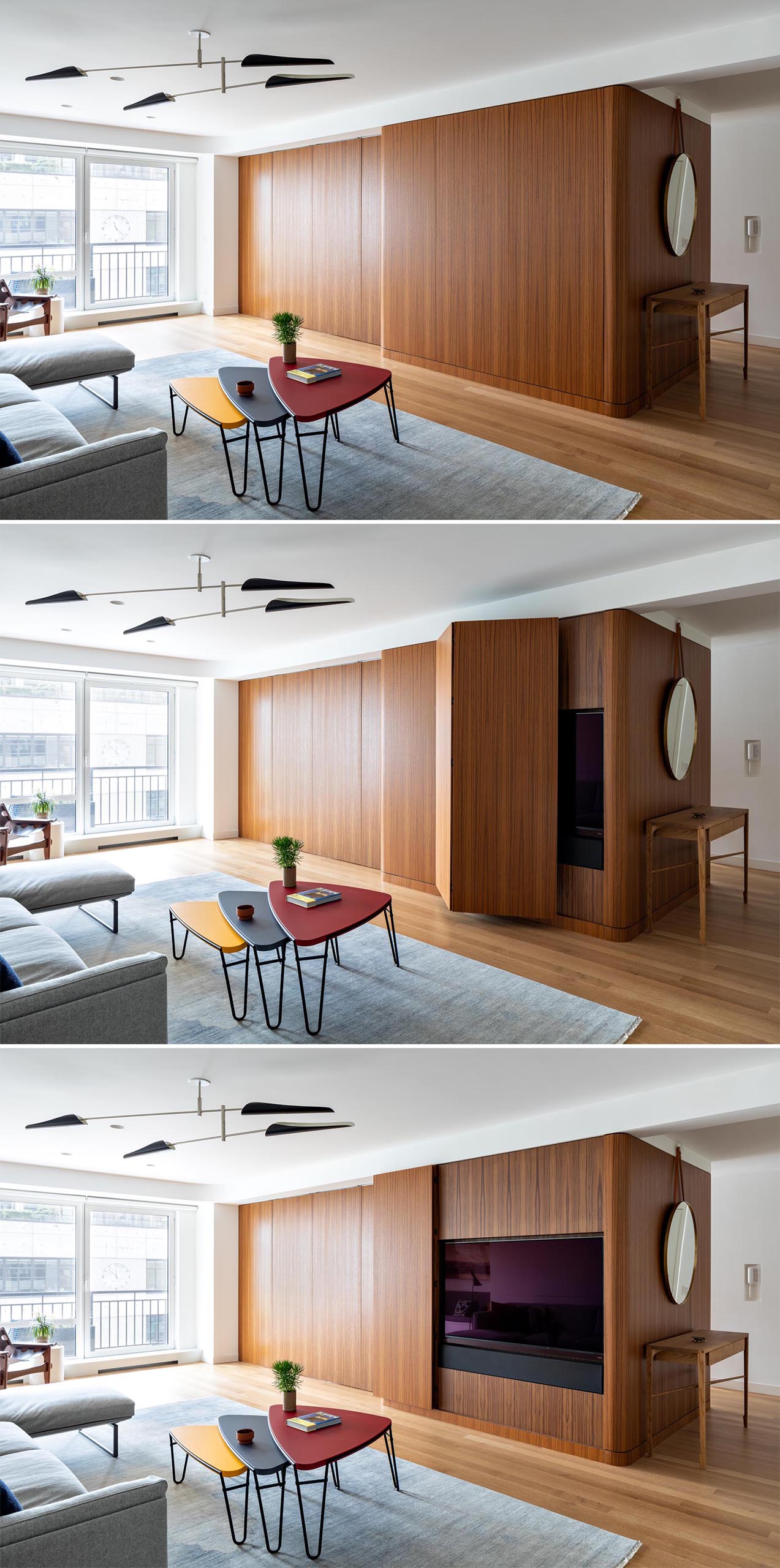 A modern apartment with a teak wall that opens to reveal the hidden TV.