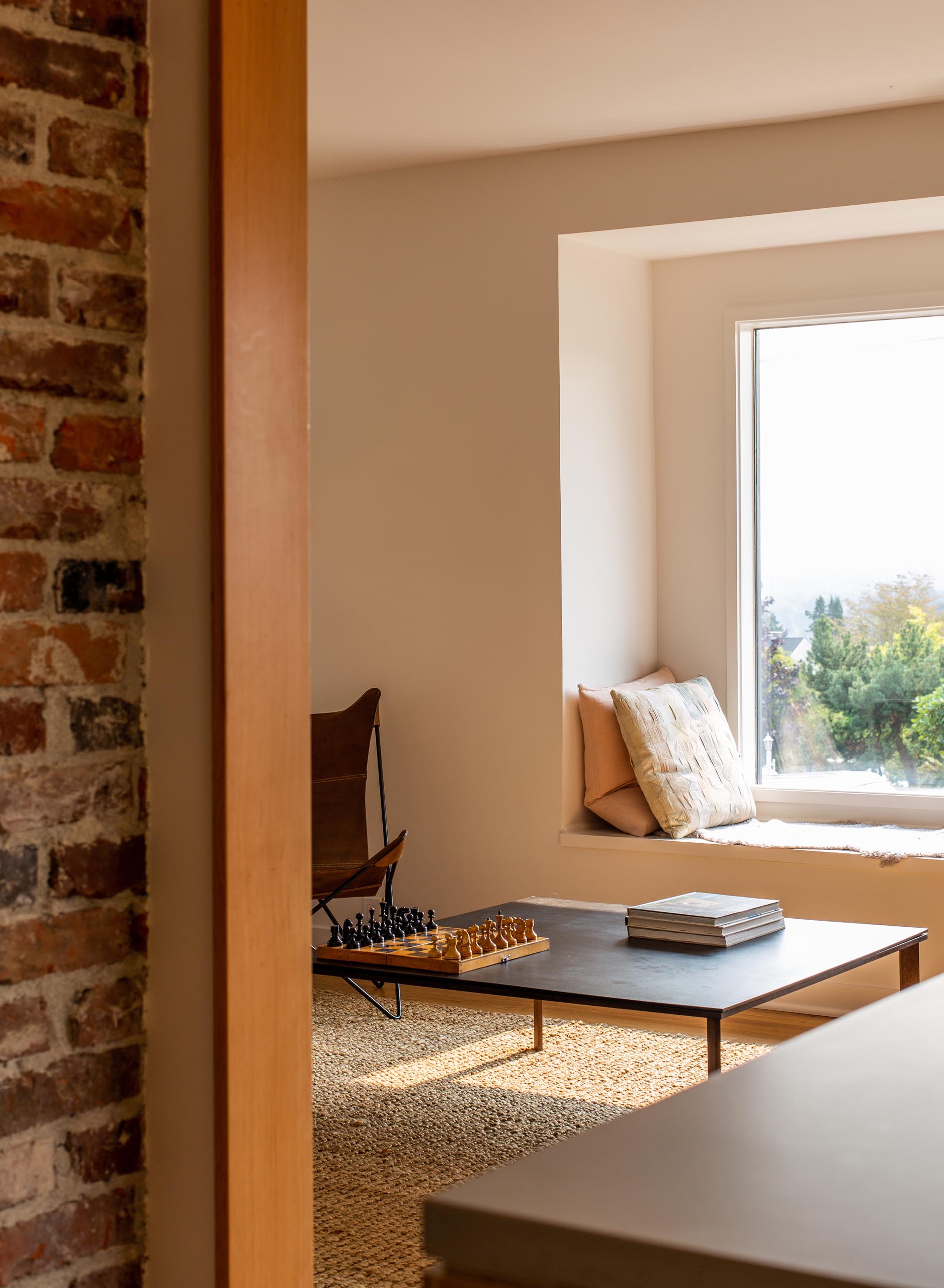 A remodeled home interior with a window seat.