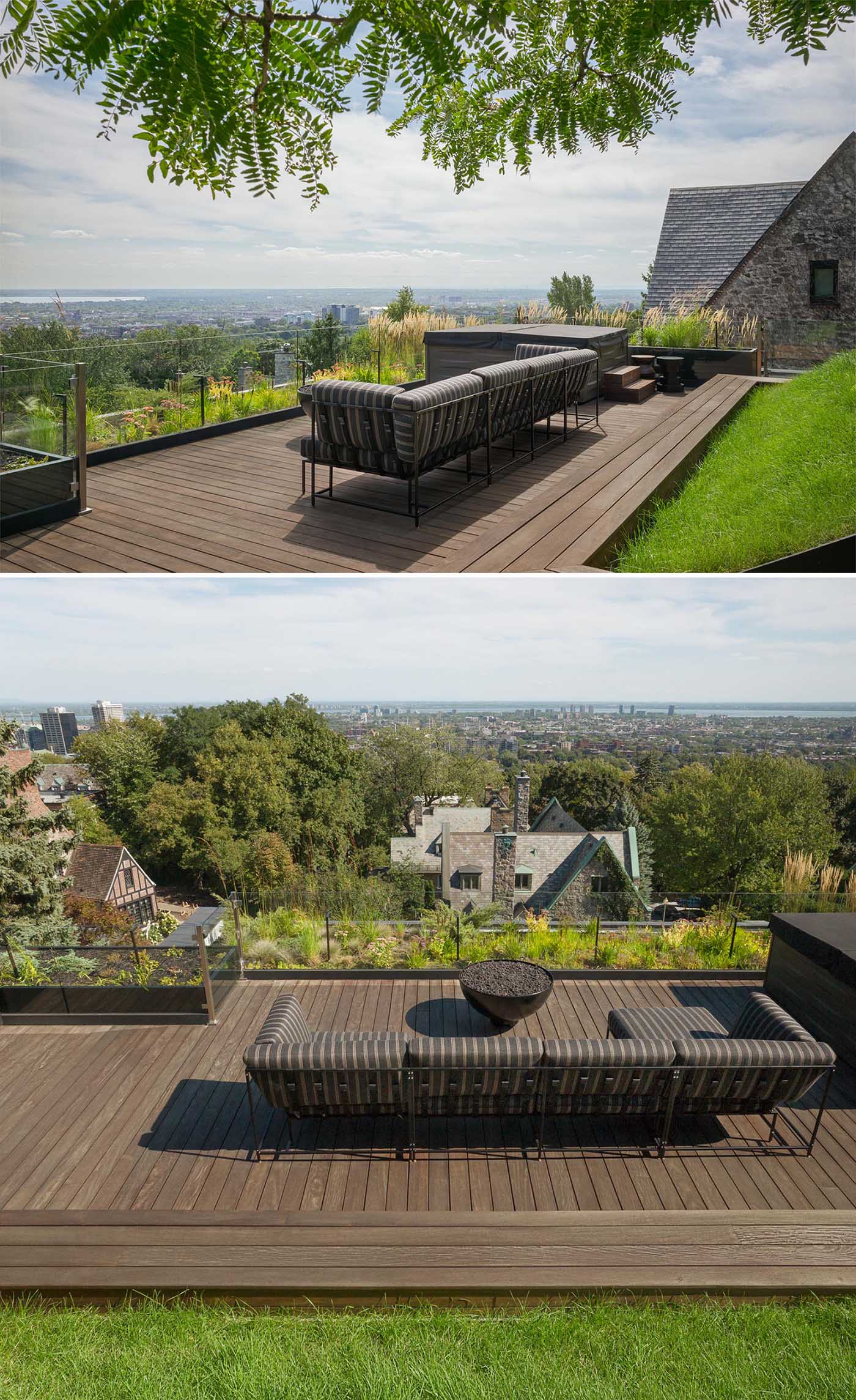 A modern rooftop terrace with an Ipe wood deck, exterior lighting, a sofa, and wildflowers.