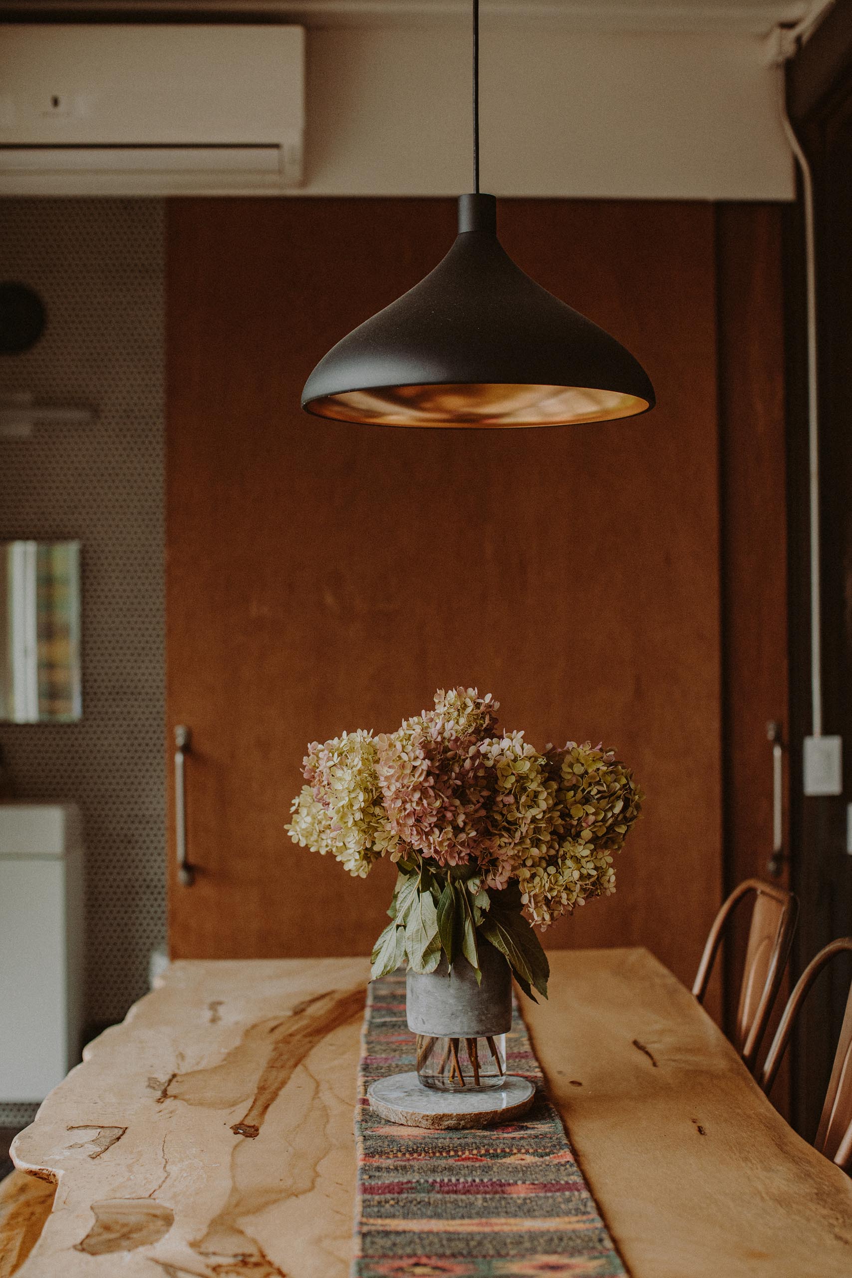 The dining room of a modern shipping container home.