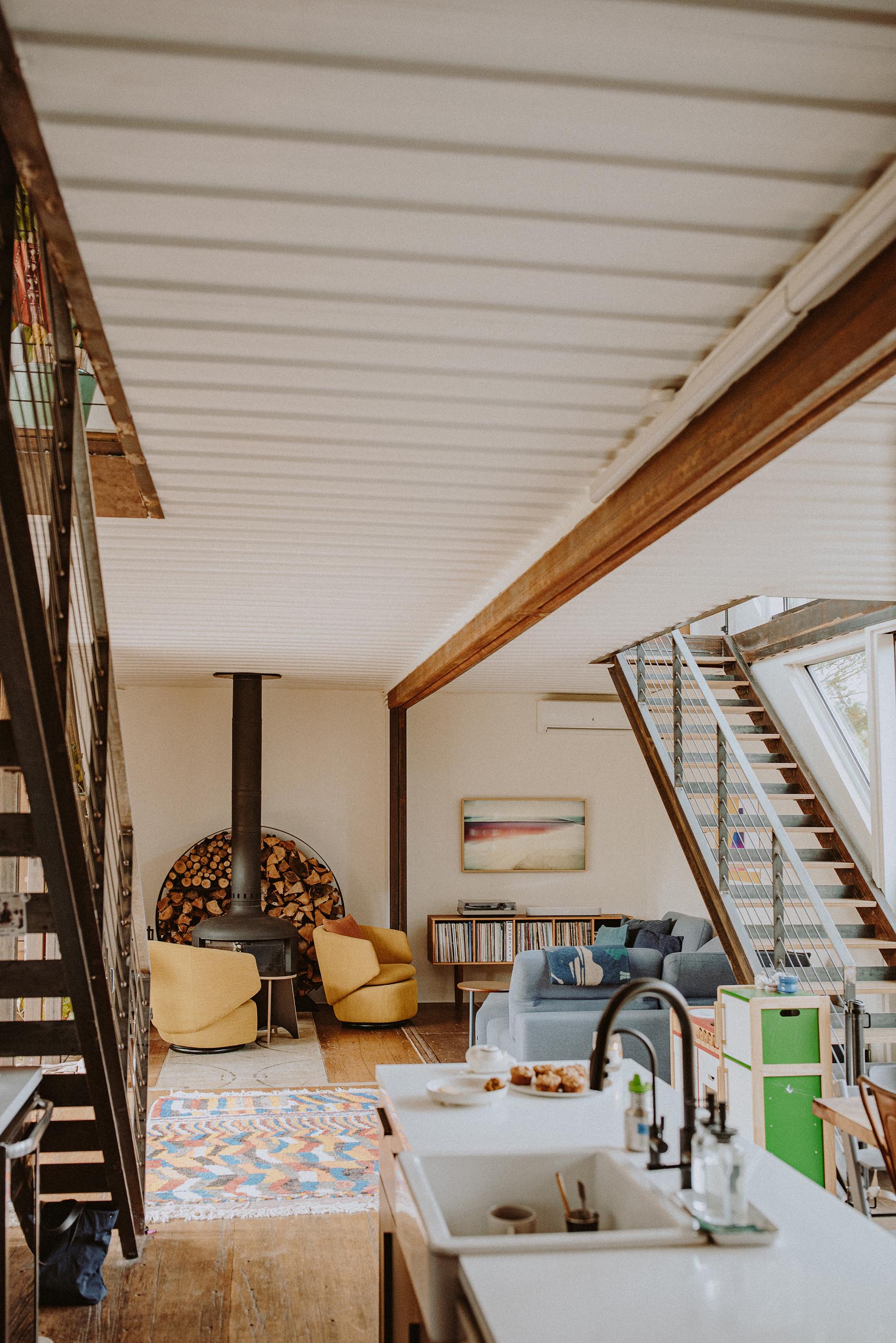 A modern shipping container home with open floor plan.