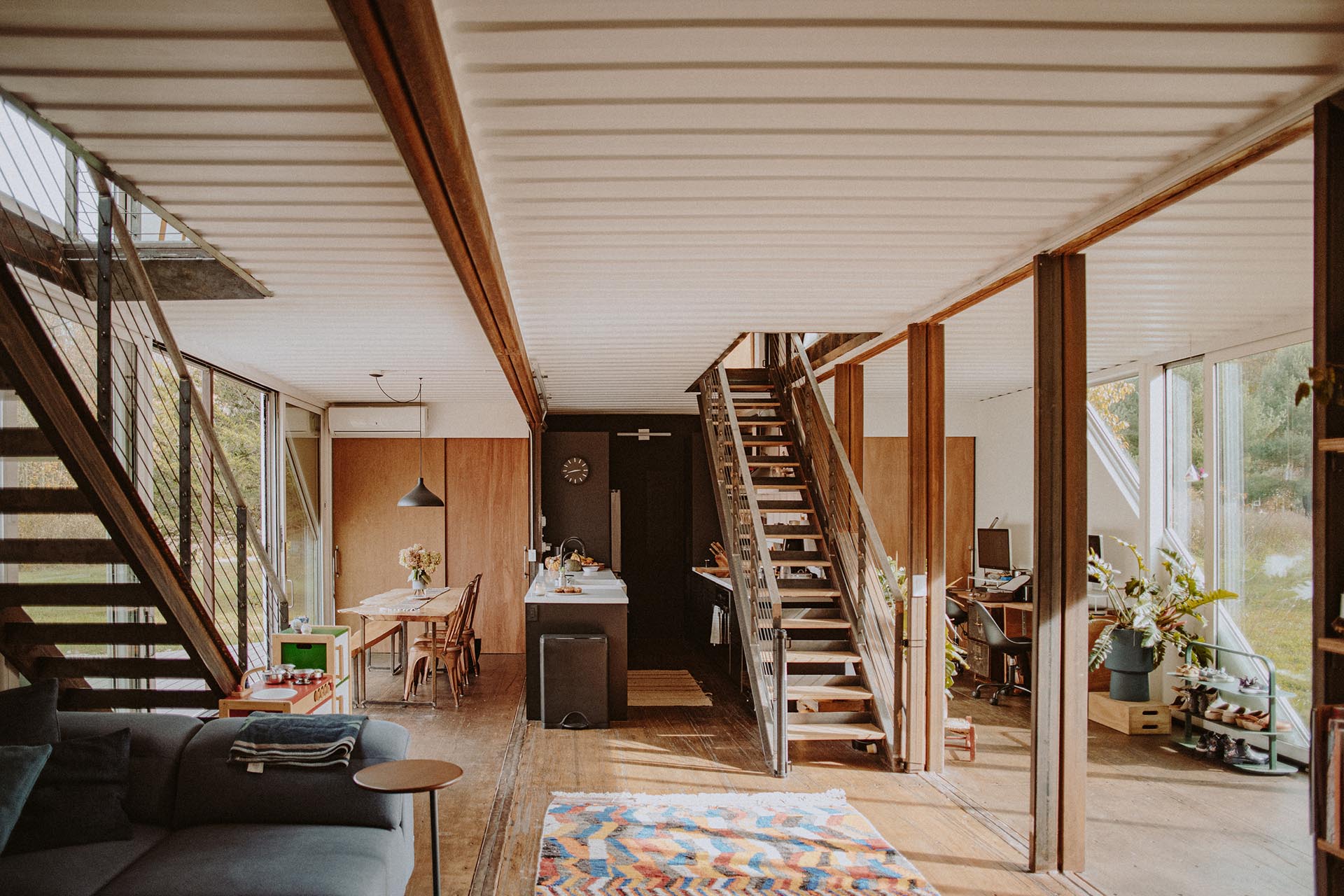 A modern shipping container home with open floor plan.