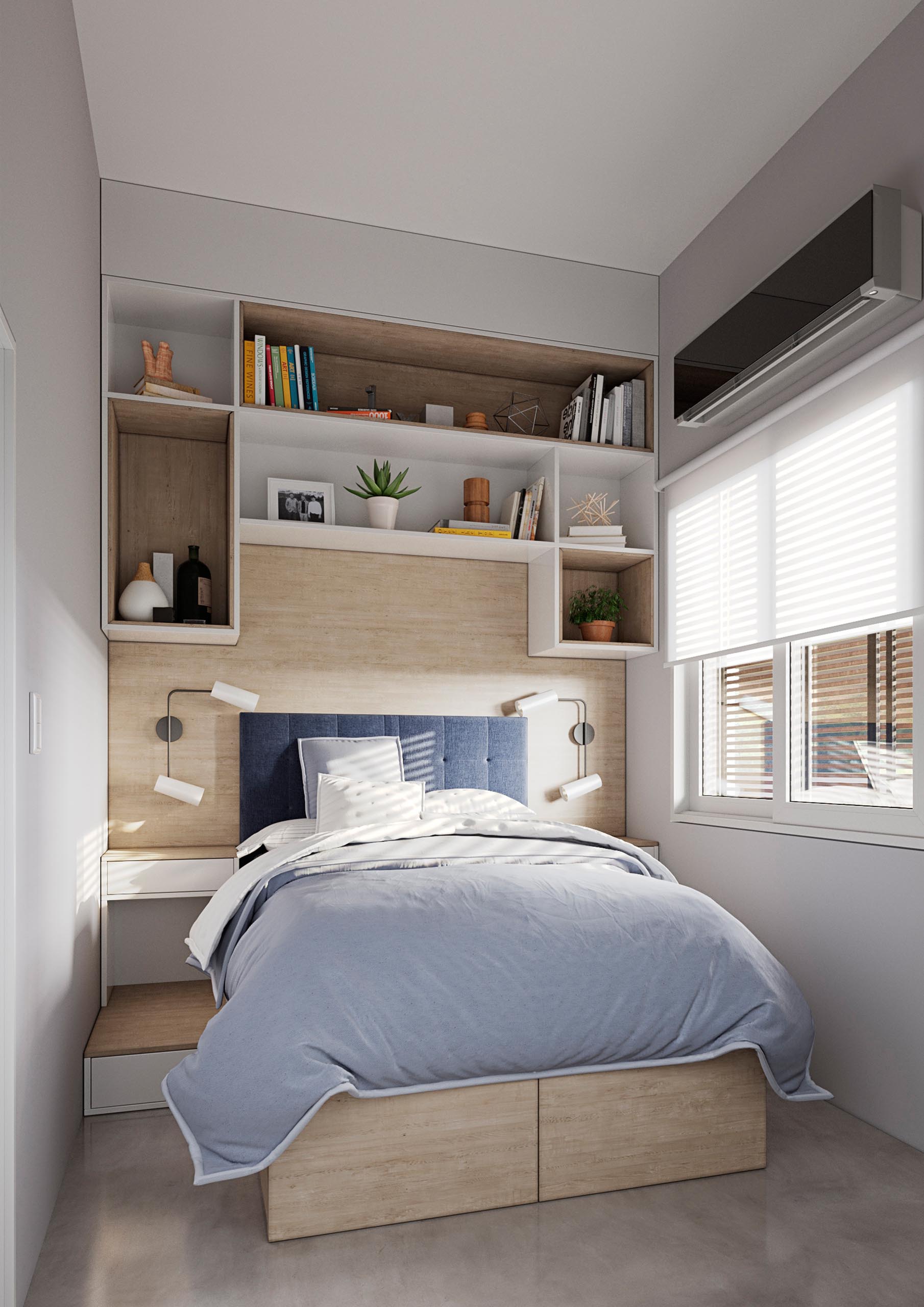 A tiny home bedroom with wood accents, white cabinetry, and storage under the bed.