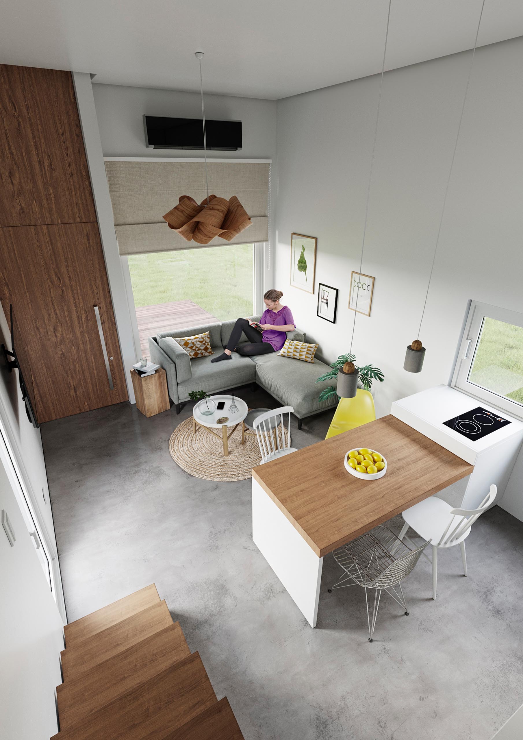 A modern precast concrete relocatable tiny home with an open plan living room, dining area, and kitchen.