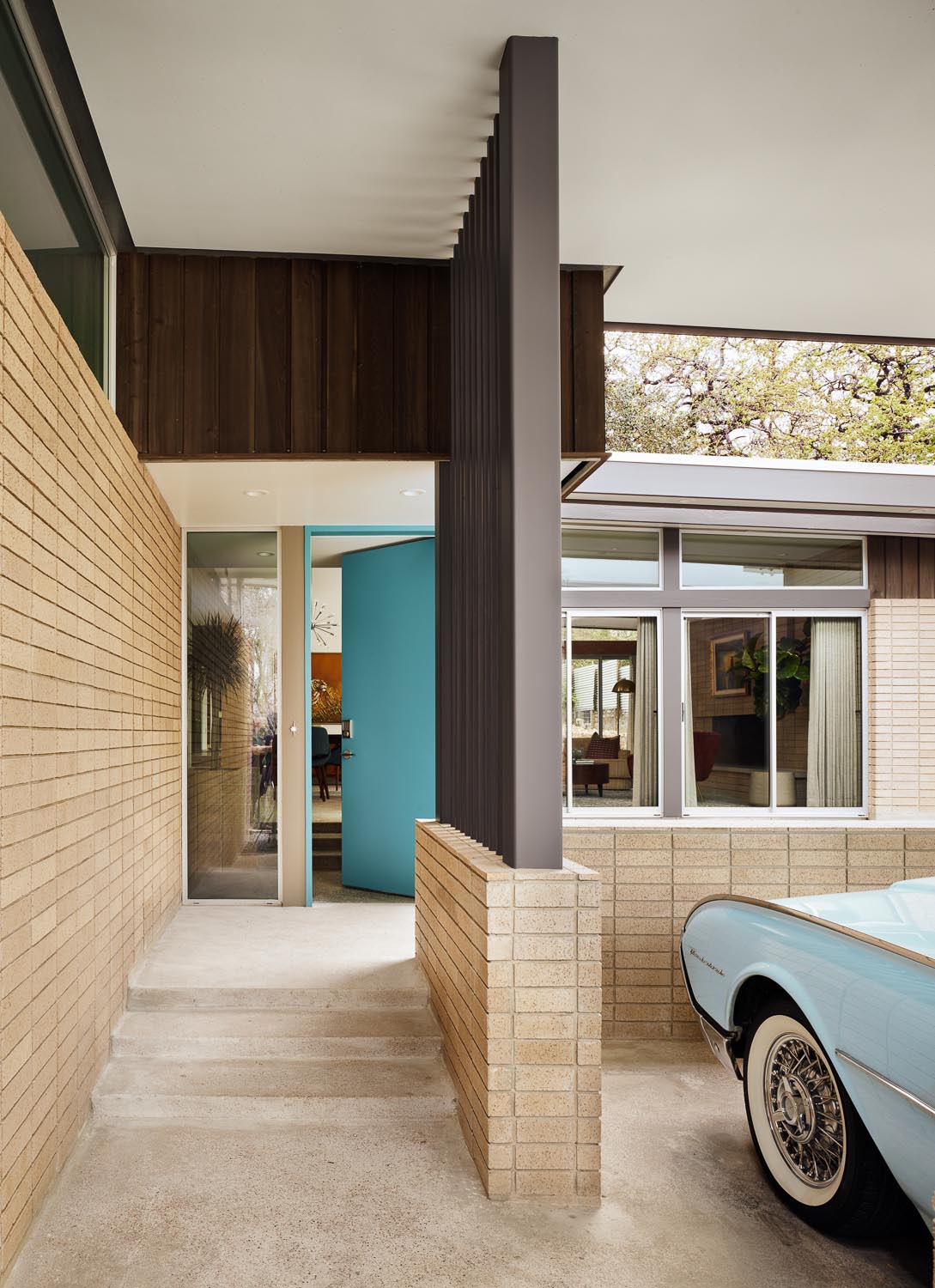 The turquoise color of this front door was inspired by the client’s appreciation of a vintage El Camino in the classic blue/aqua of the era.