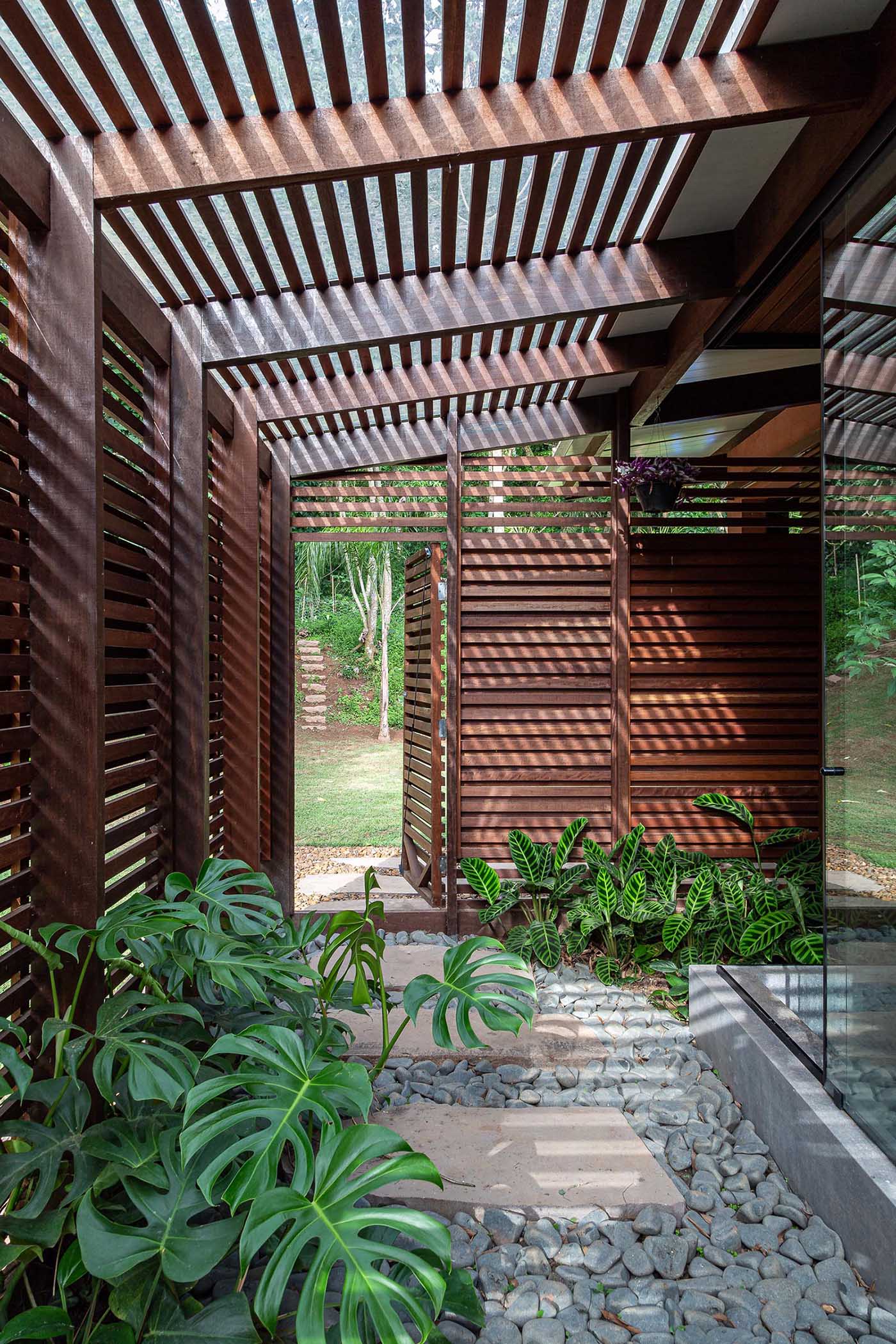 A wood slat screen allows for privacy and lets natural air and light flow through.