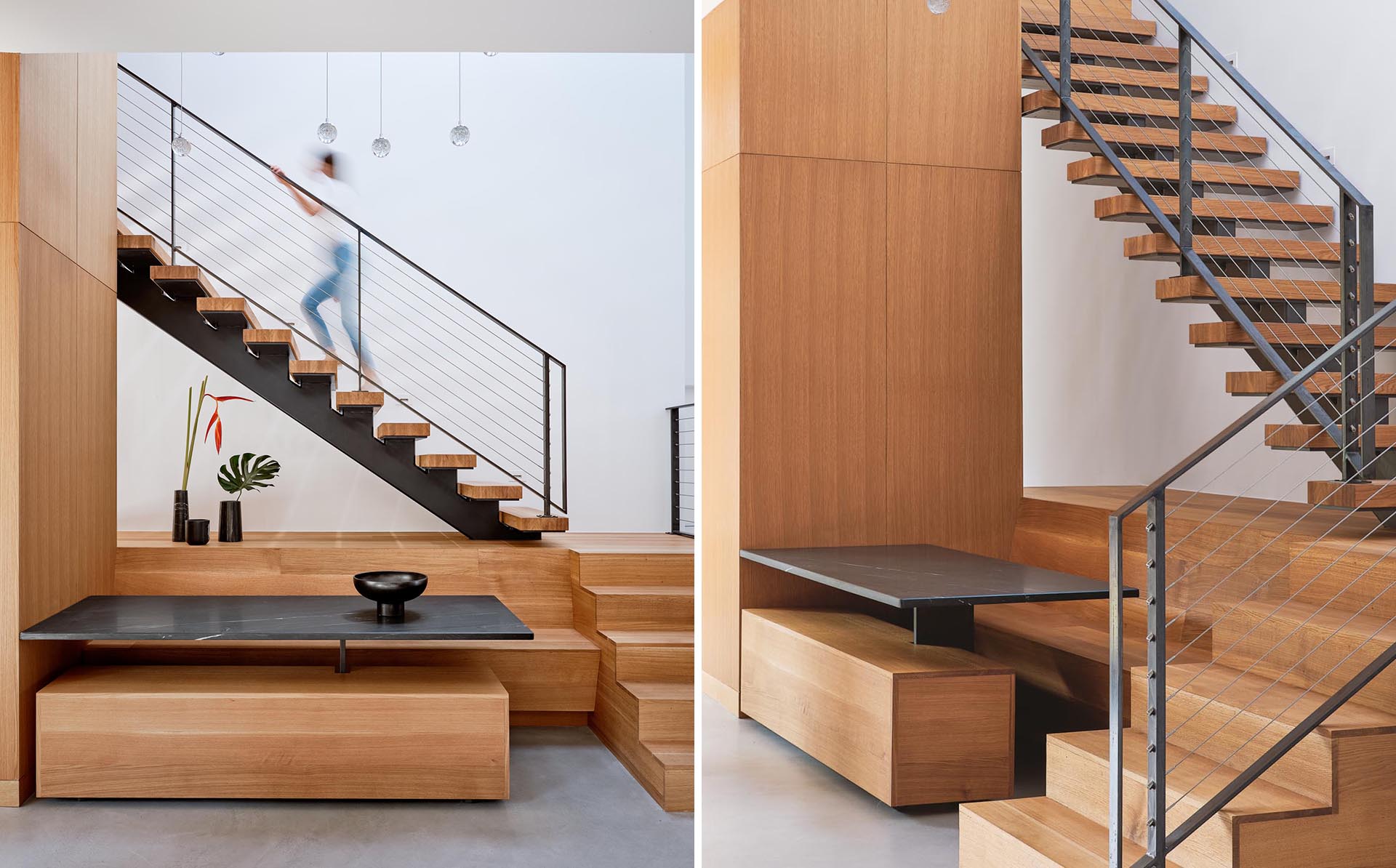 A modern house addition that includes a dining area built into the space underneath the stairs.