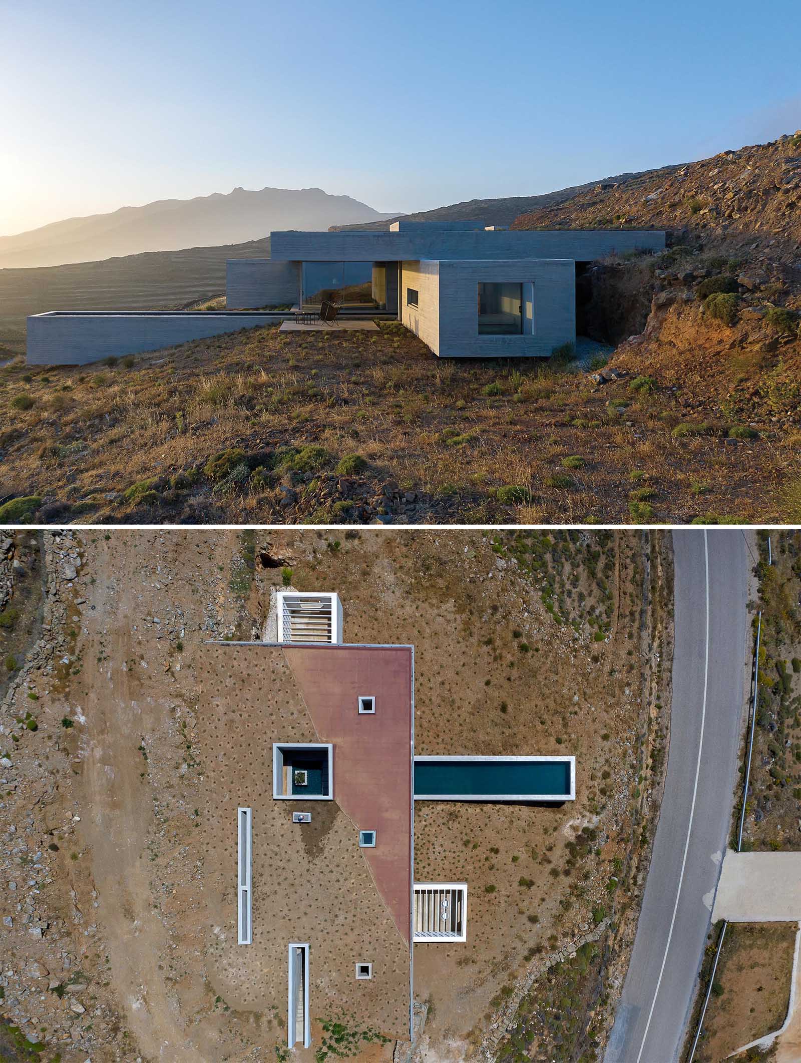 Emerging from the natural landscape as a man-made cave, this modern concrete home has been designed to somewhat blend in with its surroundings, with the partial green roof acting as a continuation of the hillside.